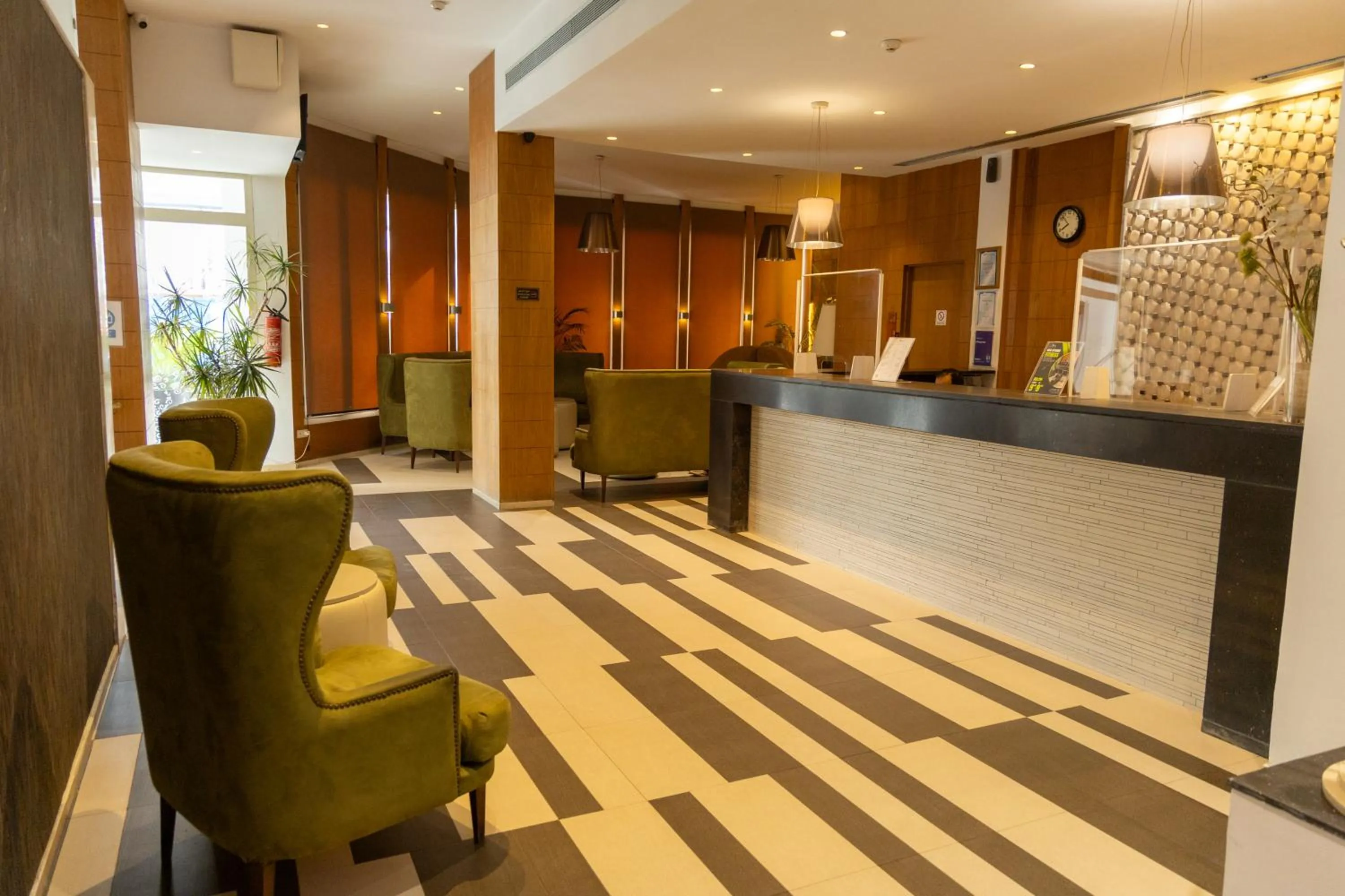 Communal lounge/ TV room in Golf Royal Hotel