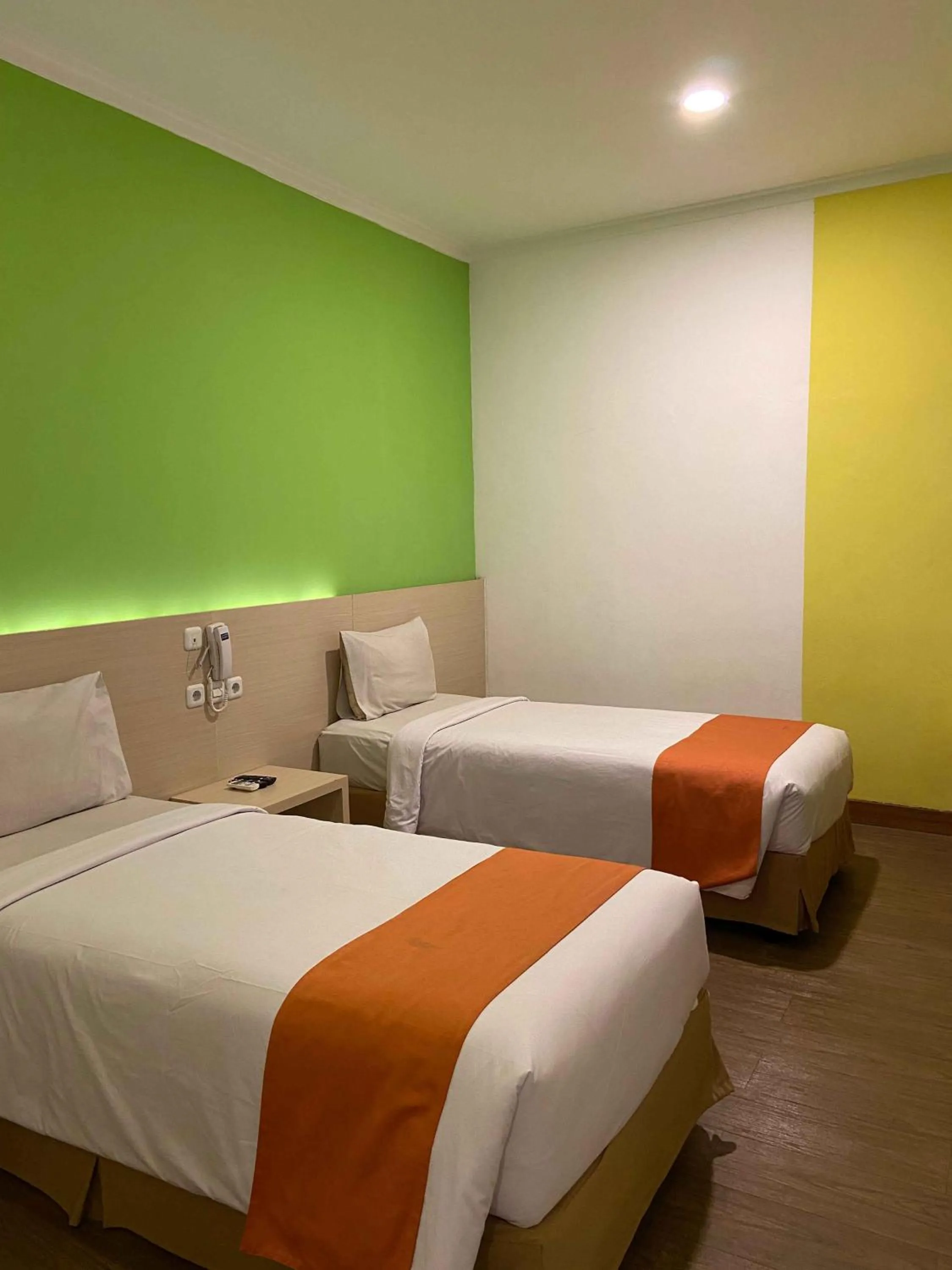 Bed in Green Red Hotel Syariah Jombang