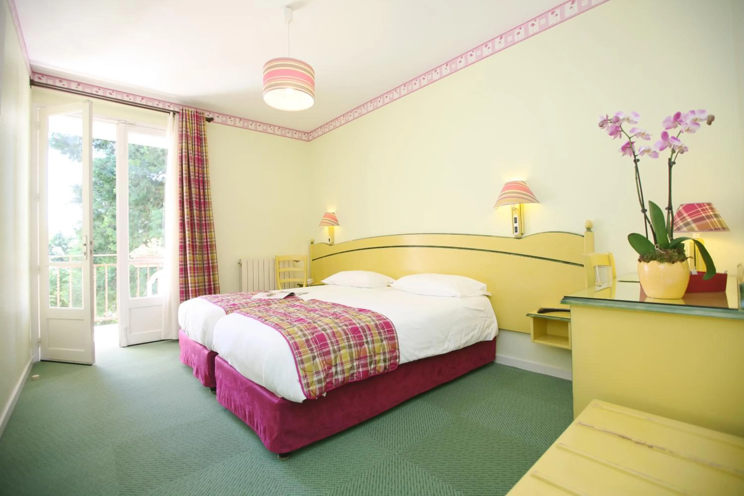 Bedroom in Logis Hôtel Restaurant Les Cèdres