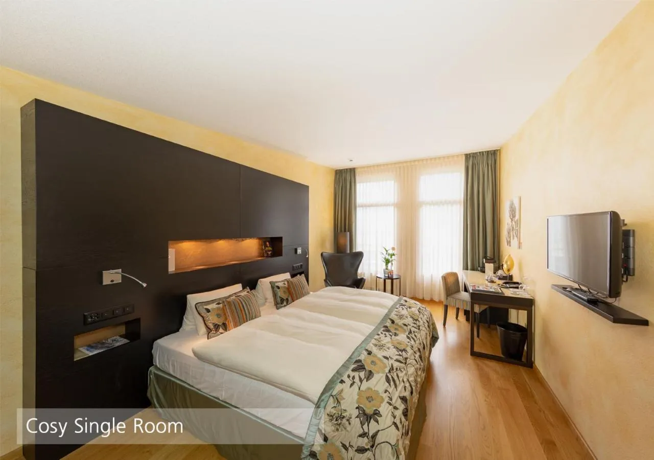 Bedroom, Bed in Lenkerhof gourmet spa resort - Relais & Châteaux