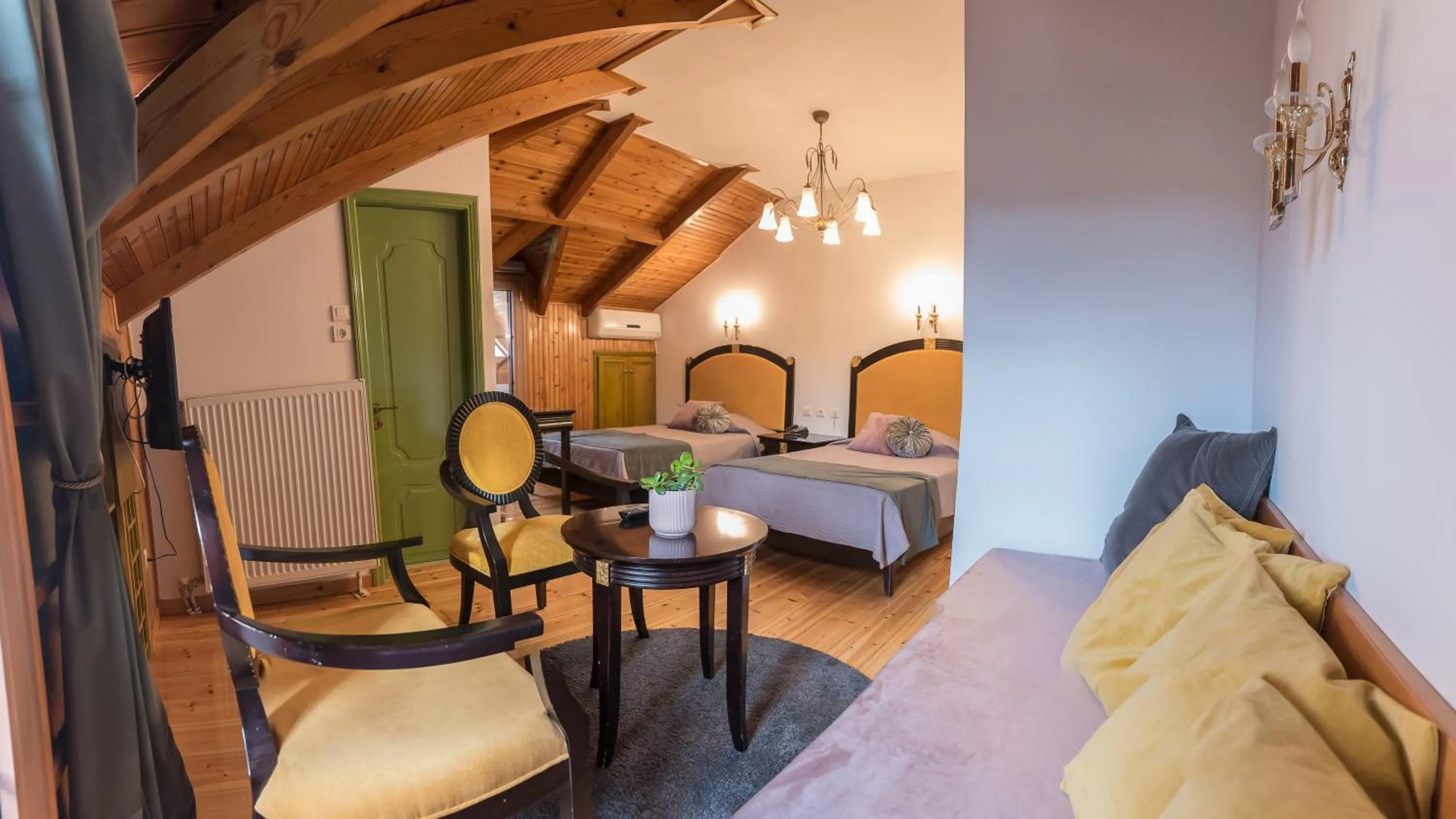 Seating area, Bed in Krikonis Hotel