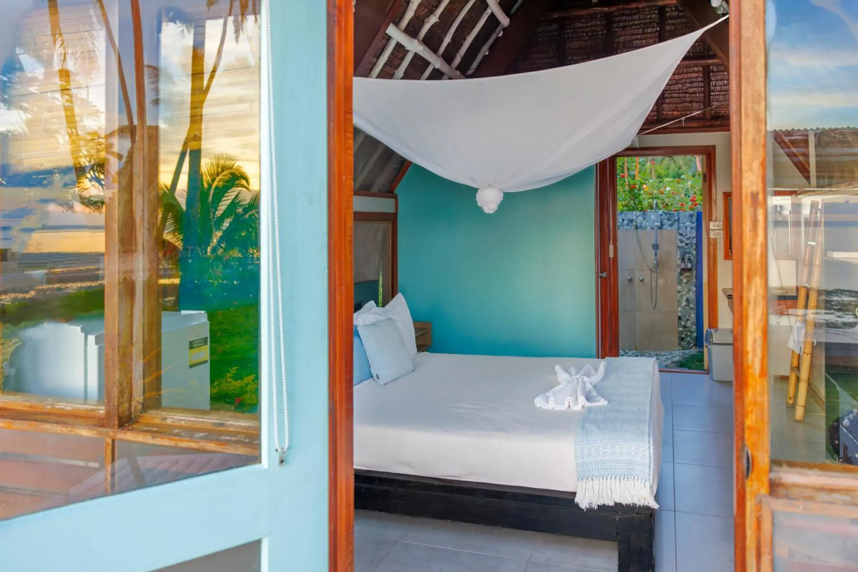 Bed in Mango Bay Resort Bed in Mango Bay Resort