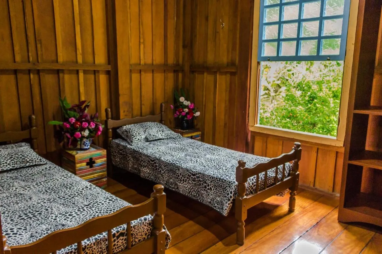 Bed in Pousada Trem das Cores