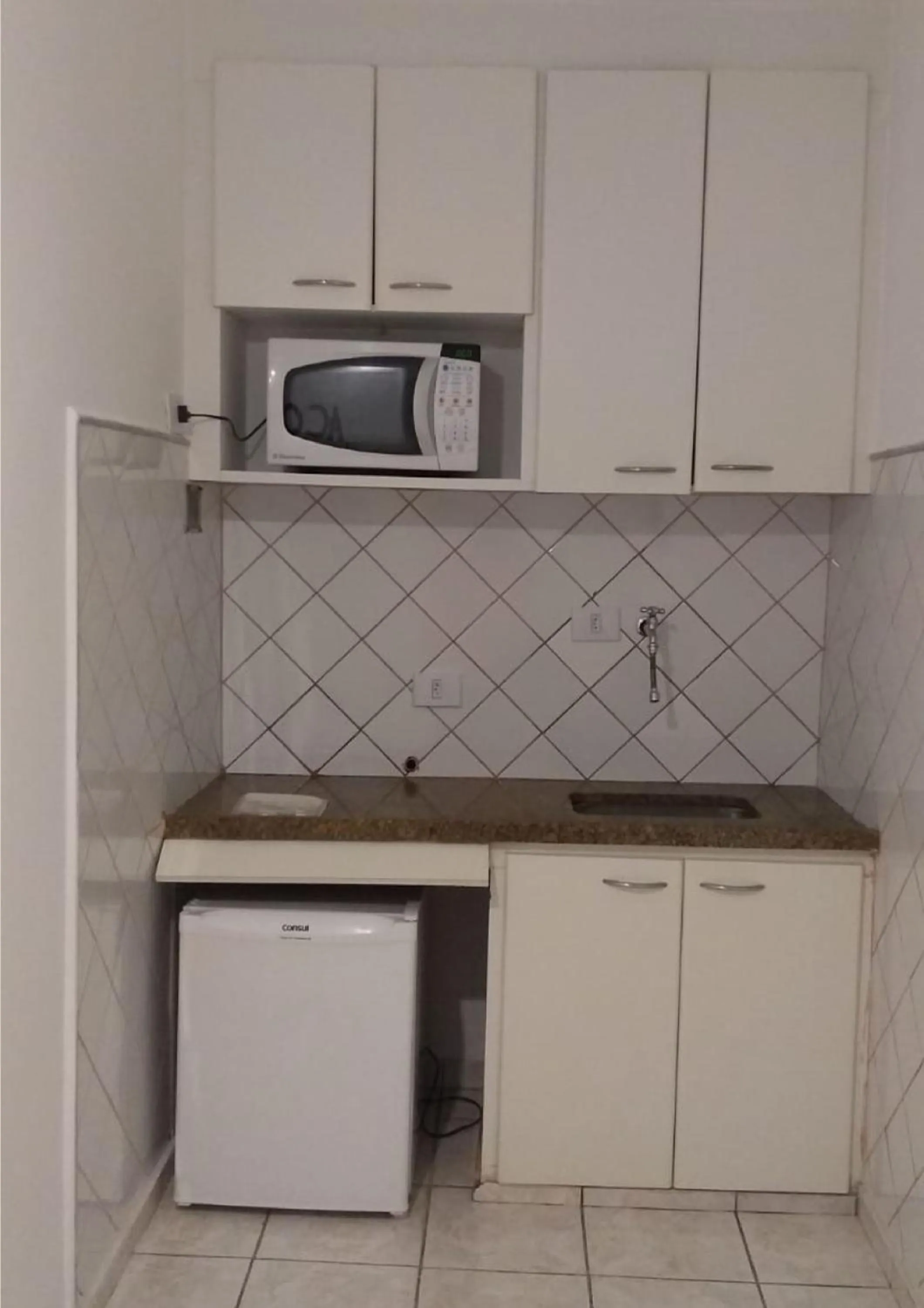 Kitchen or kitchenette in Bela Cintra Flat Service