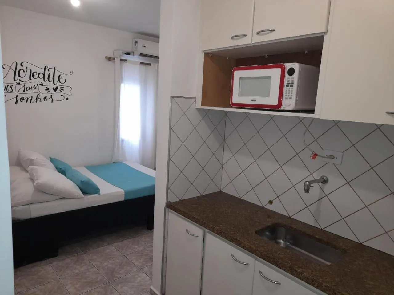 Kitchen or kitchenette, Bed in Bela Cintra Flat Service