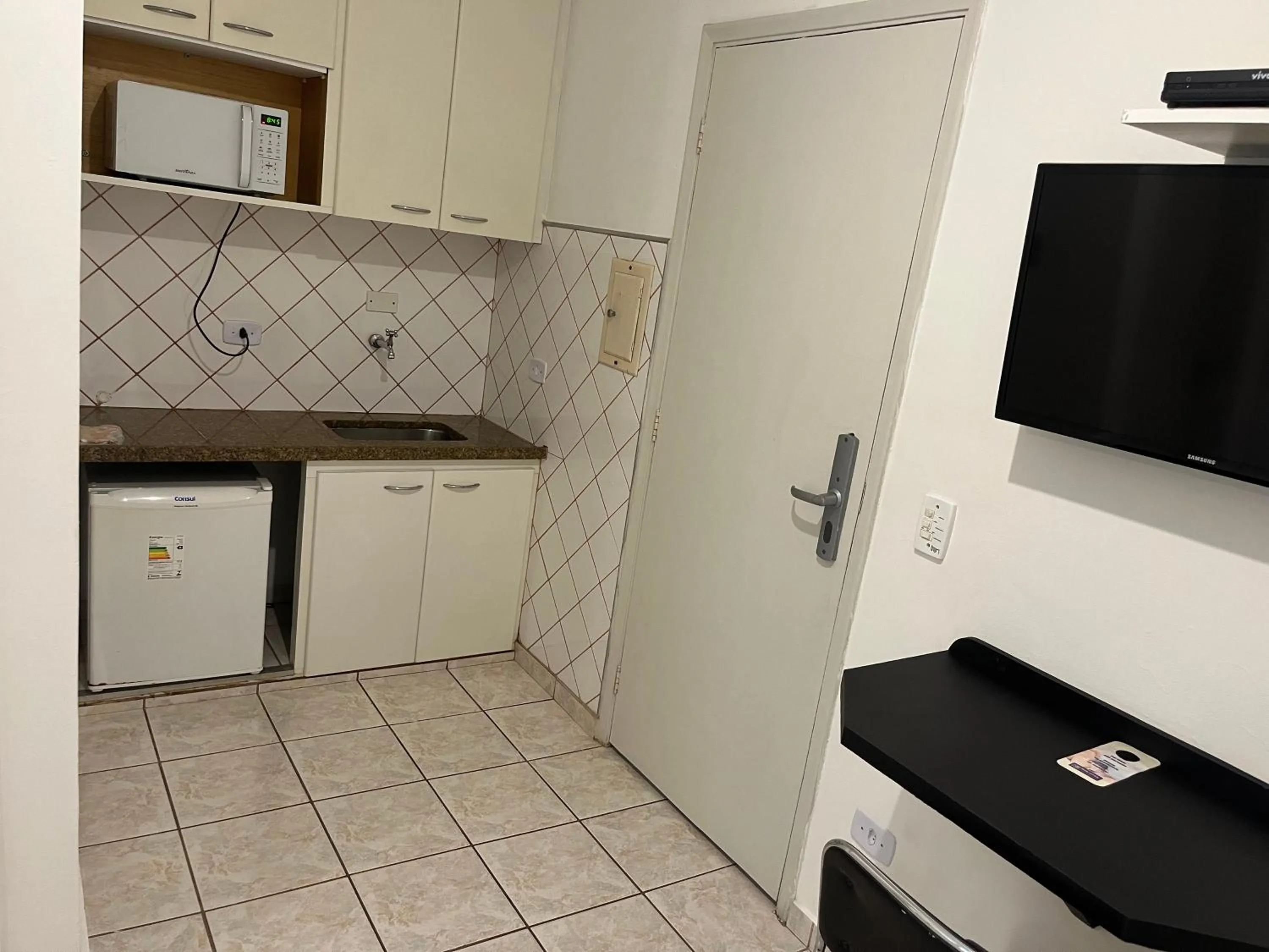 Kitchen or kitchenette in Bela Cintra Flat Service