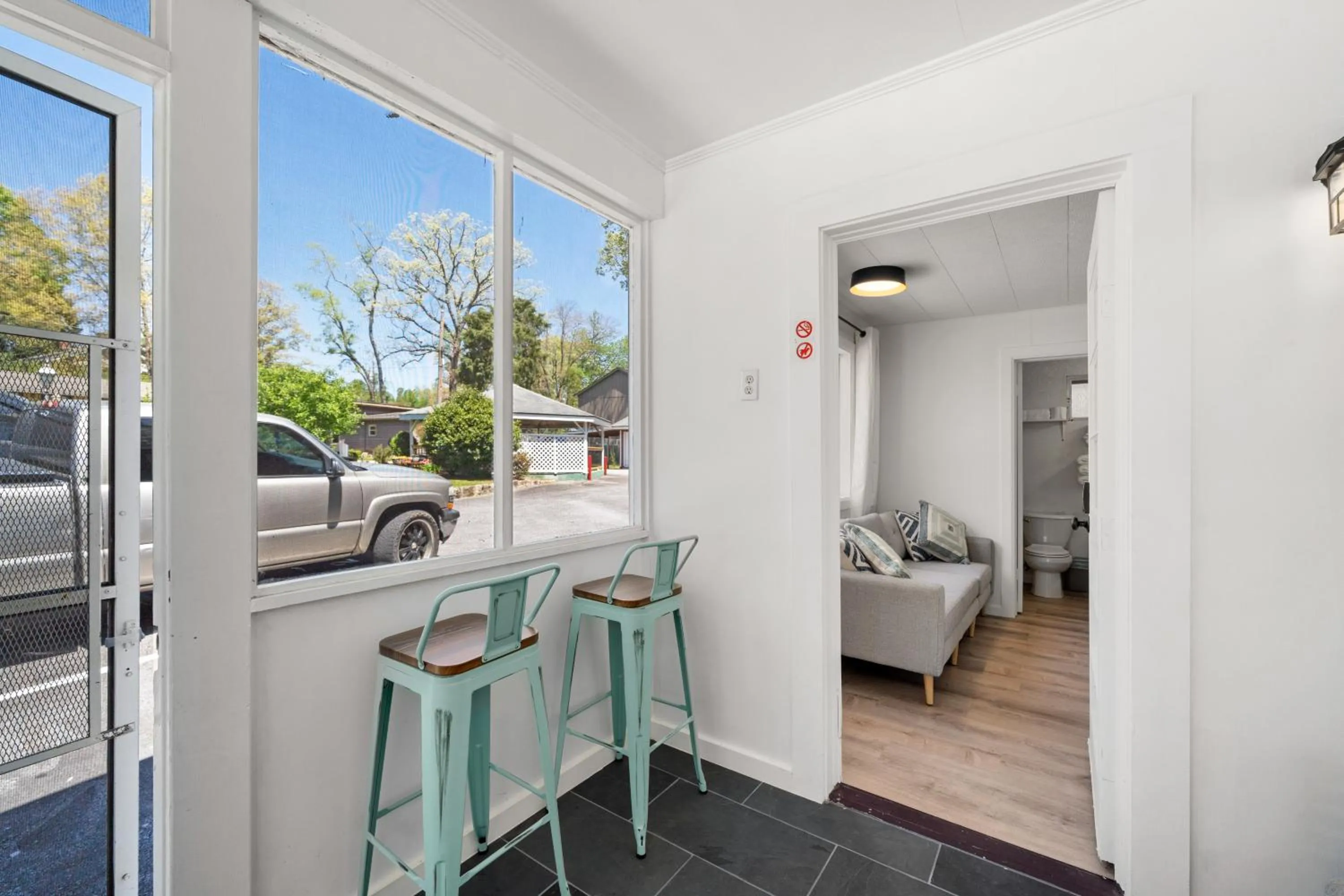Seating area, Bed in CedarWood Inn