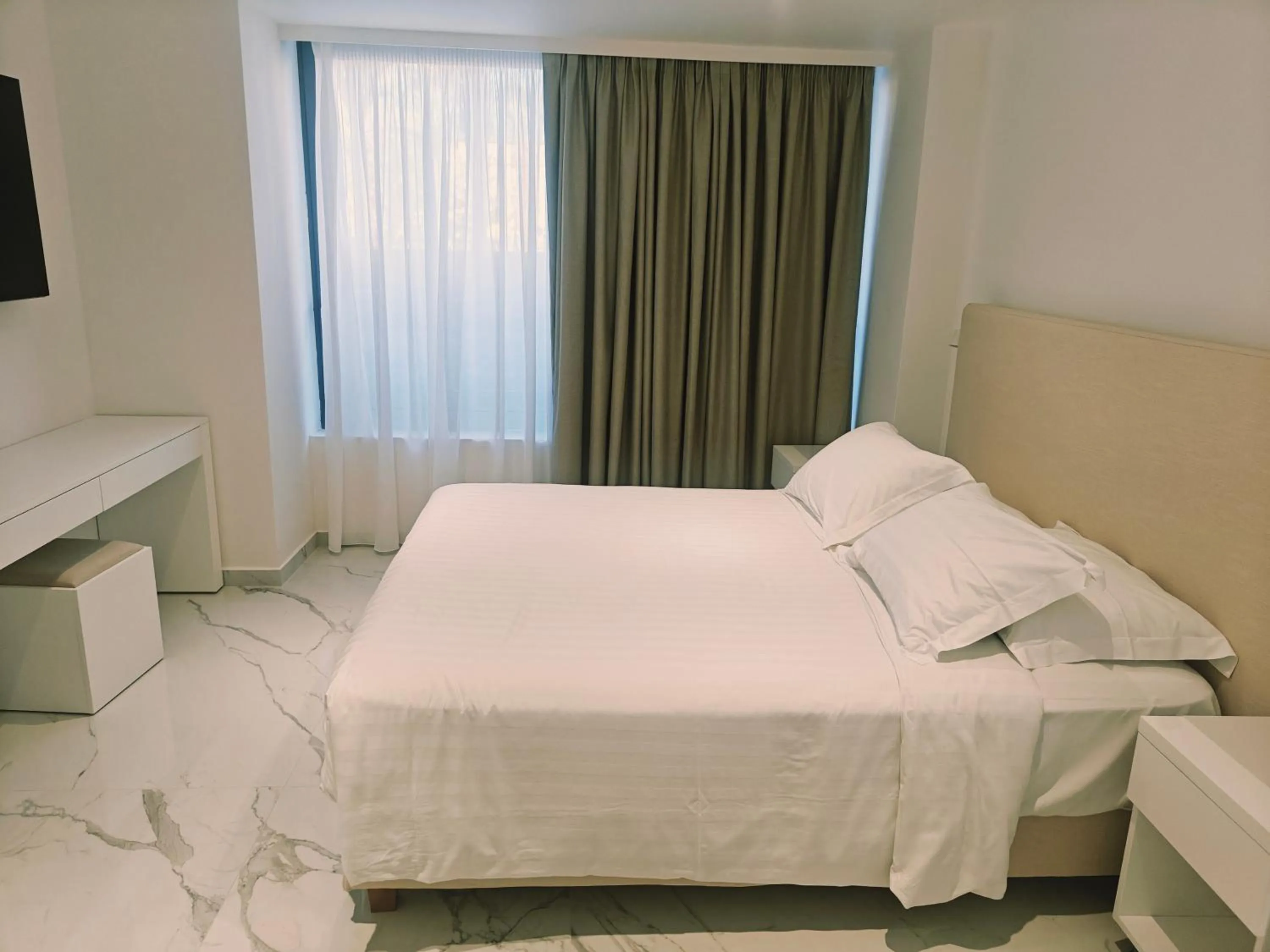 Bed in Ibiscus Hotel