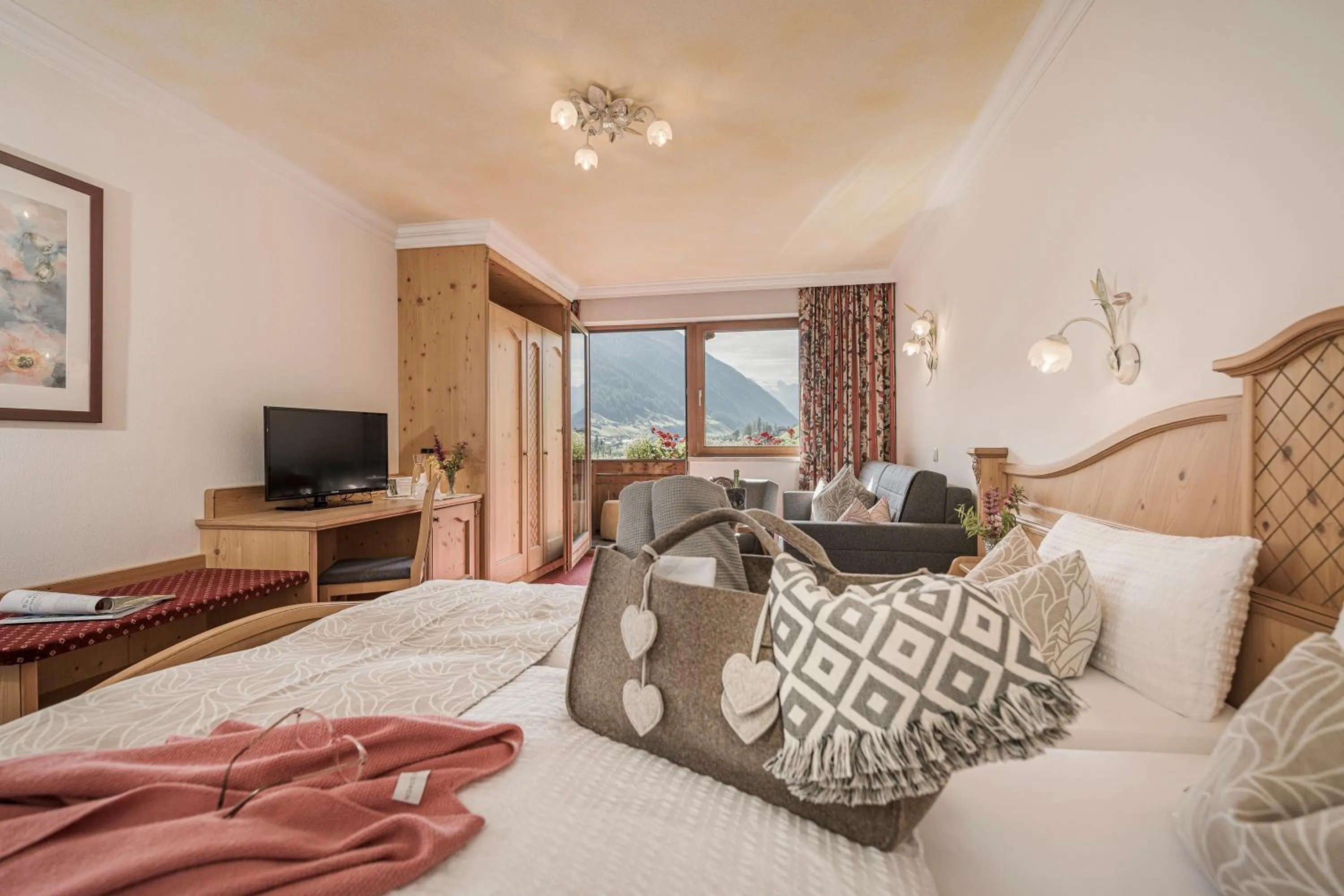 Photo of the whole room, Bed in Biohotel Rastbichlhof