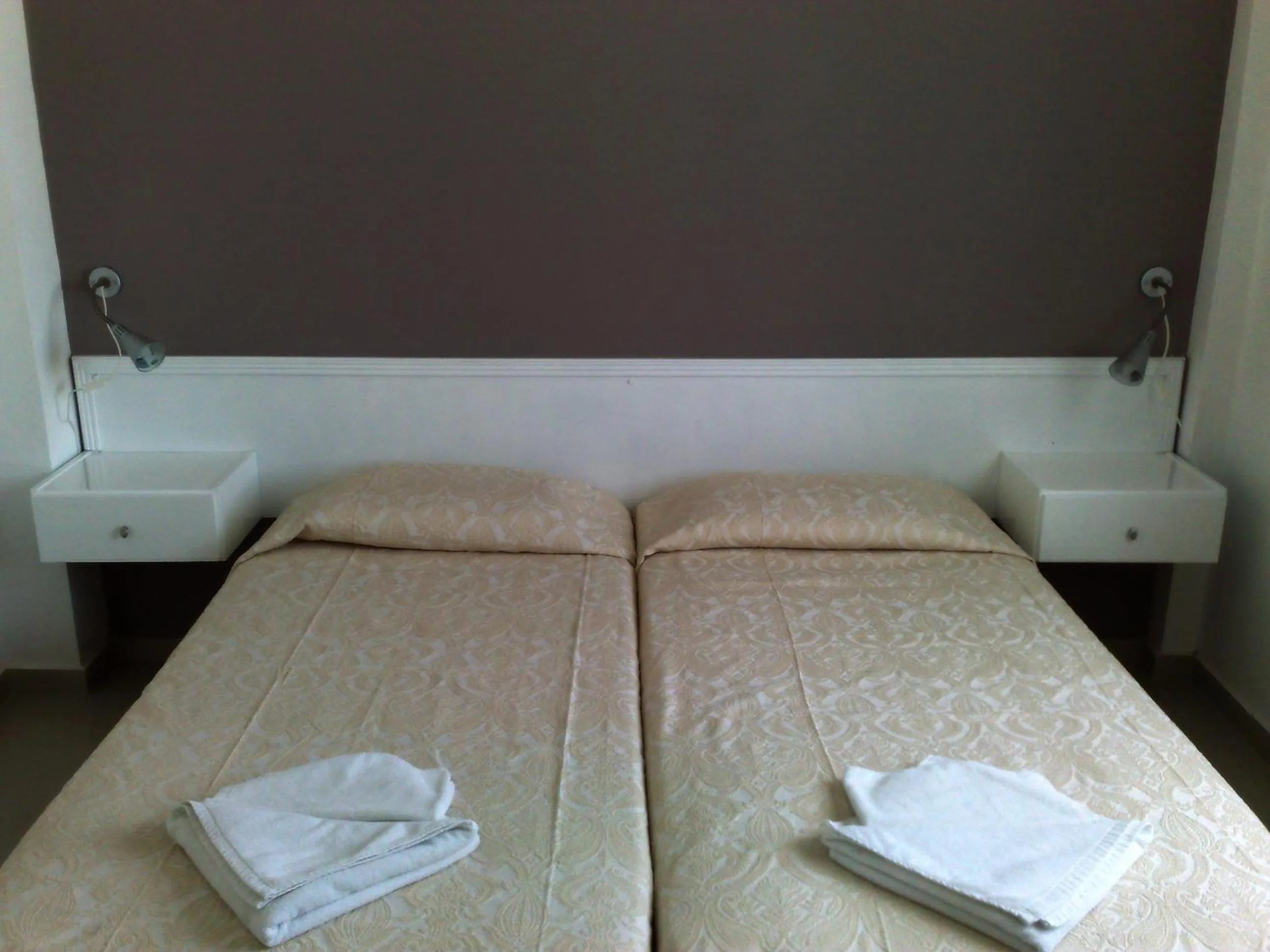 Bed in Hilltop Gardens Hotel Apartments