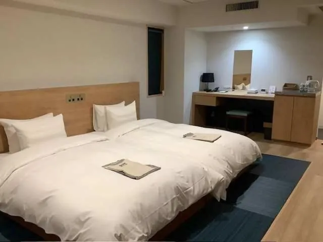 Bed in Awa Kanko Hotel