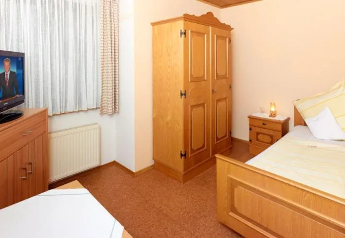 Bed in Hotel Garni Assion