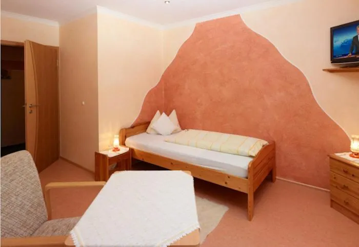 Bed in Hotel Garni Assion