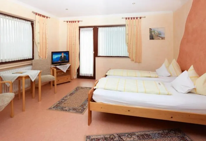 Bed in Hotel Garni Assion