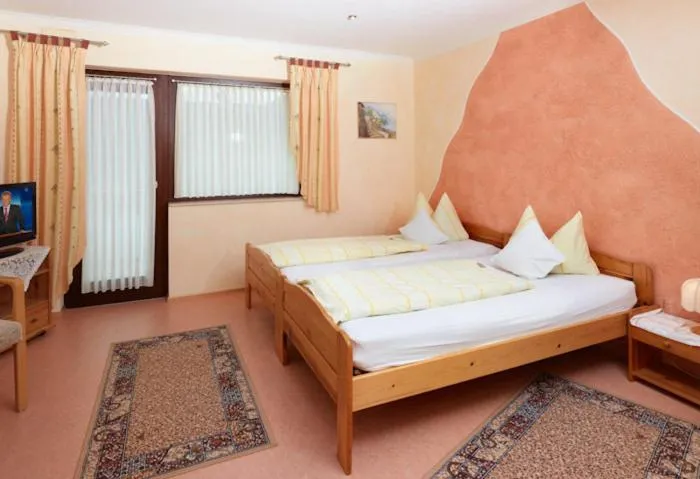 Bed in Hotel Garni Assion