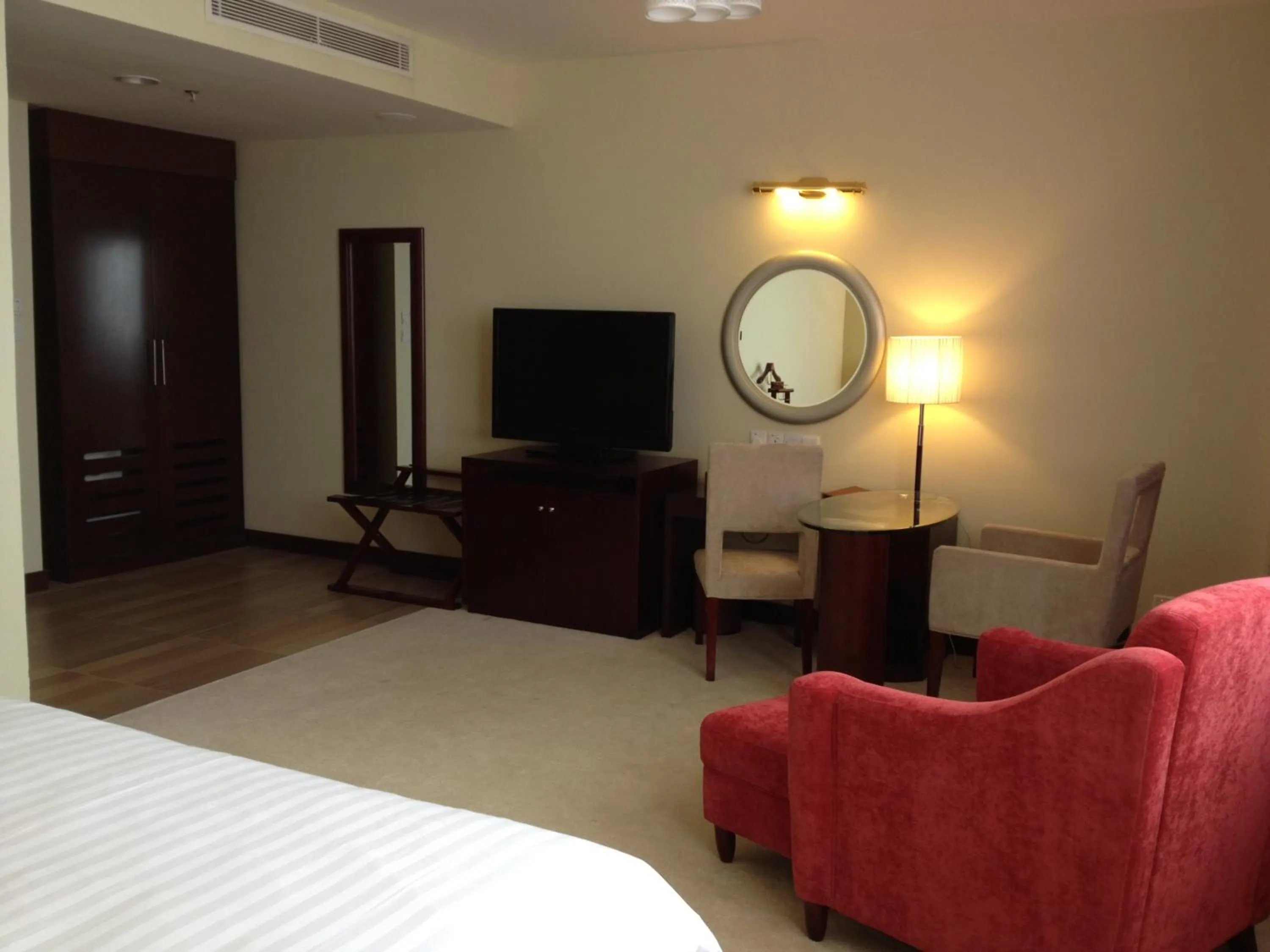 Seating area, Bed in Gaya Centre Hotel