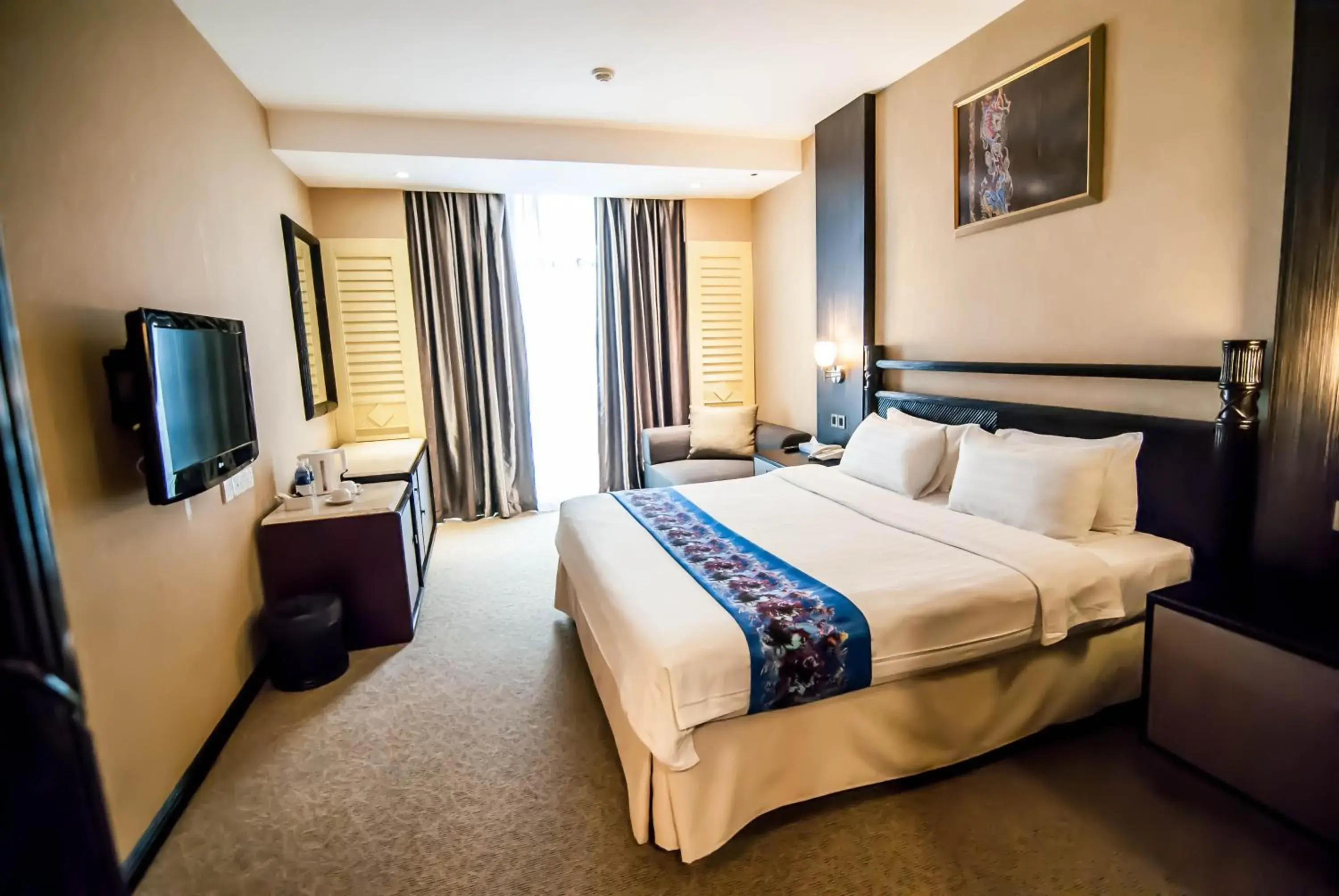 Bed in KK Times Square Hotel Bed in KK Times Square Hotel