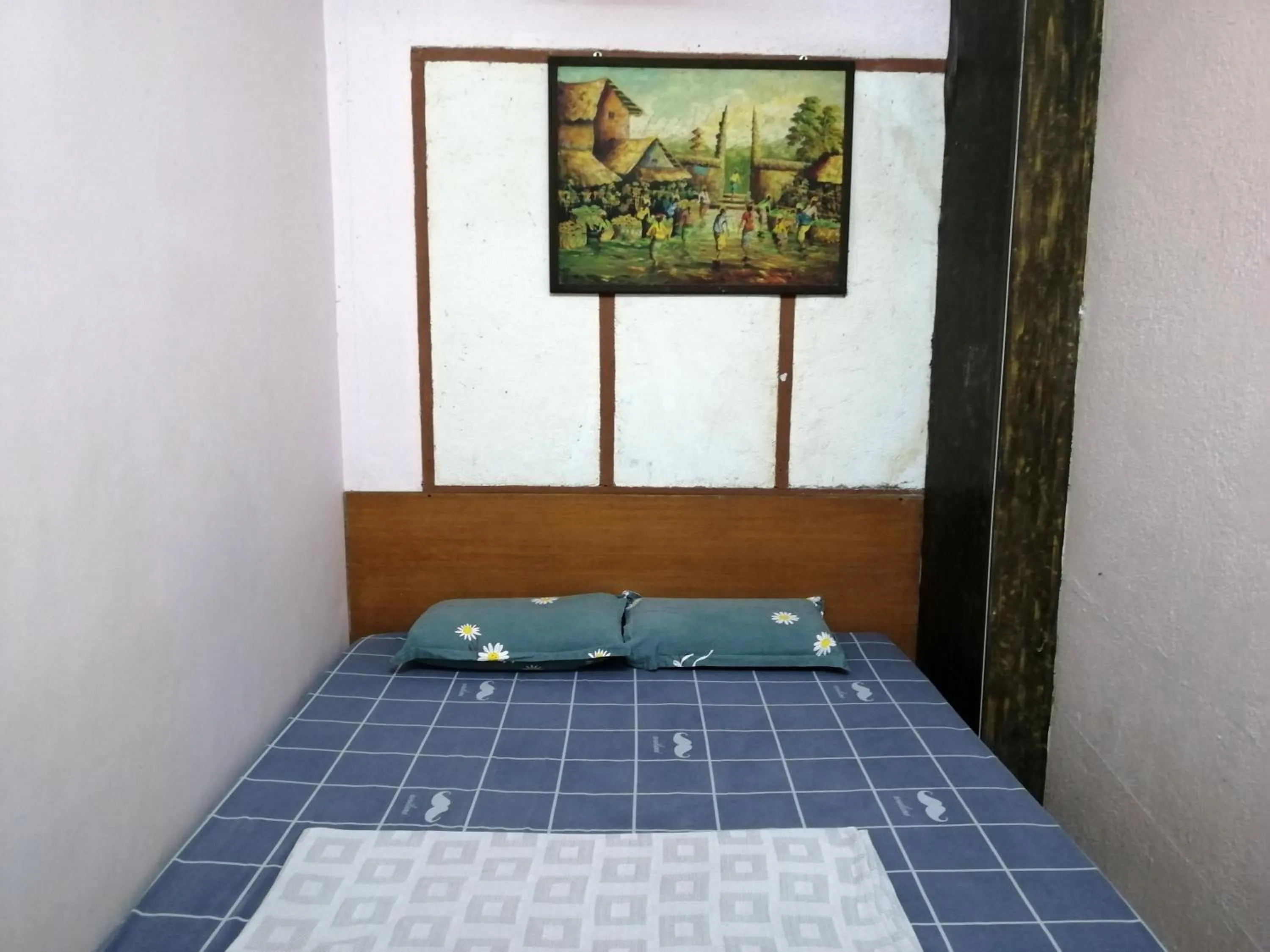 Bed in New Budget Inn Hotel