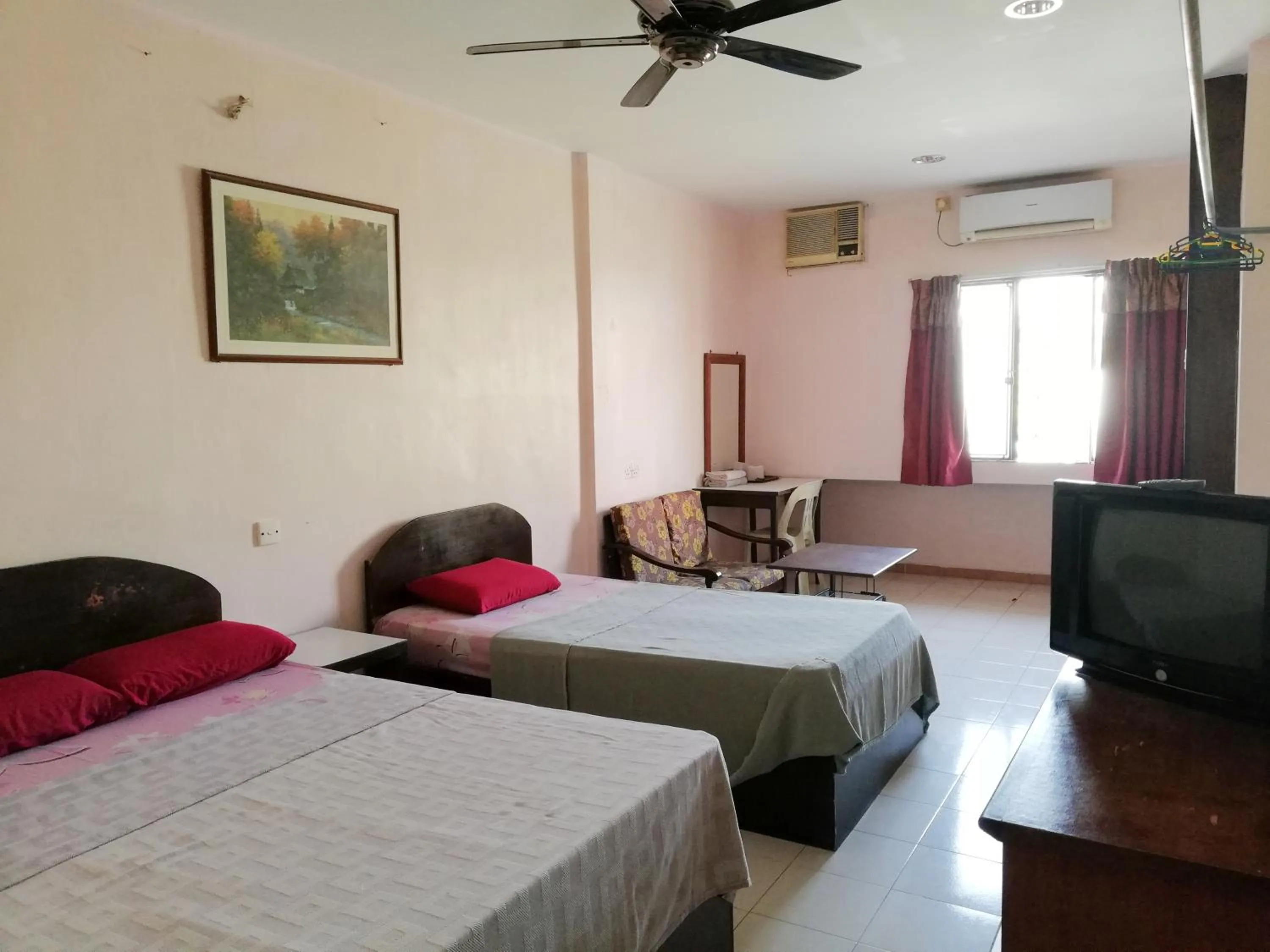 Bed in New Budget Inn Hotel