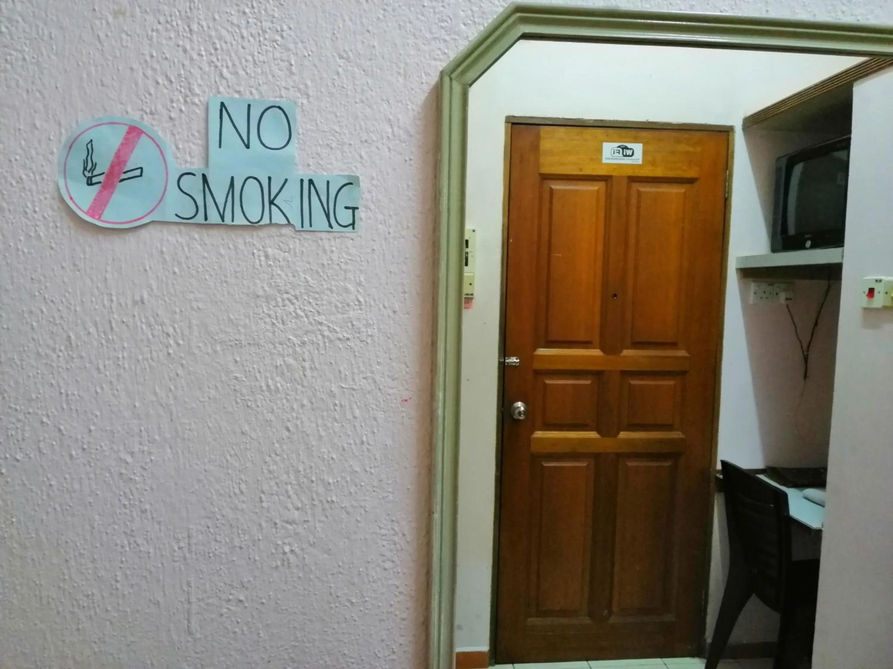 Text overlay in New Budget Inn Hotel