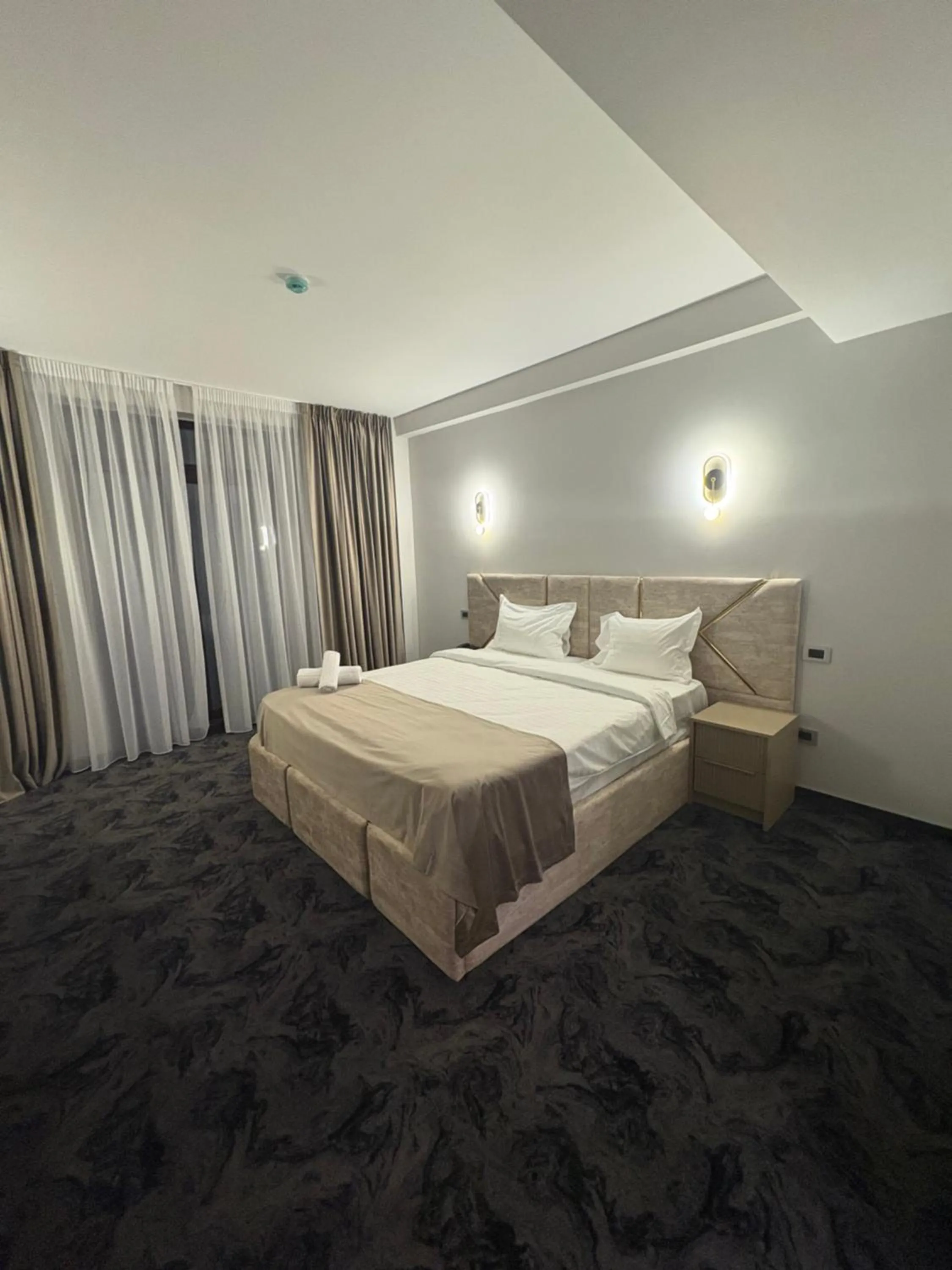 Bed in Black Tulip Hotel