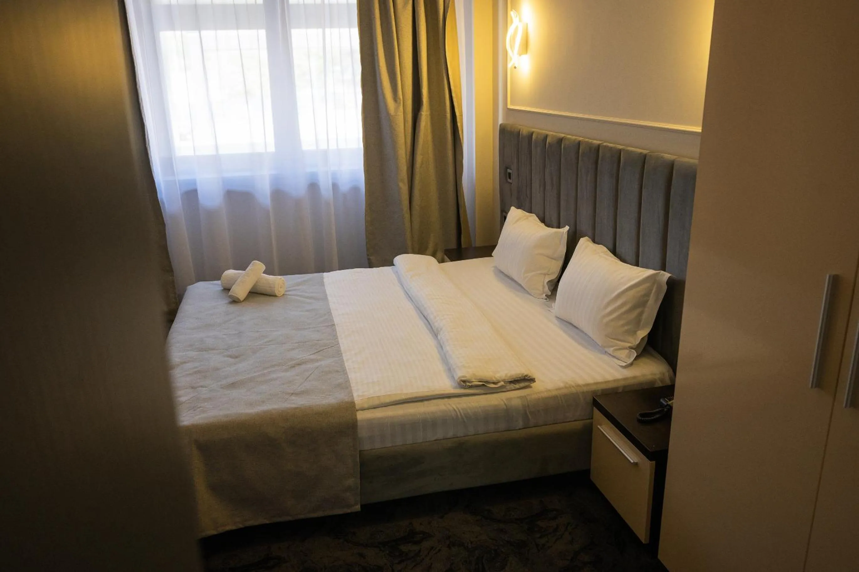 Bed in Black Tulip Hotel