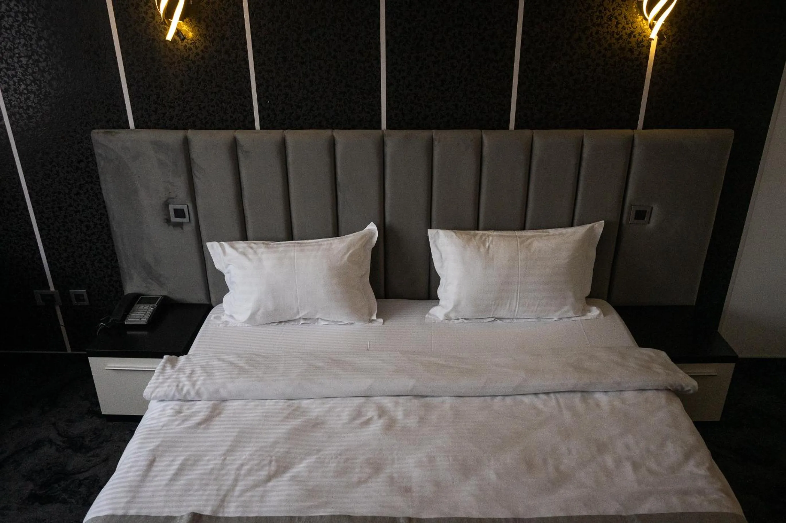 Bed in Black Tulip Hotel