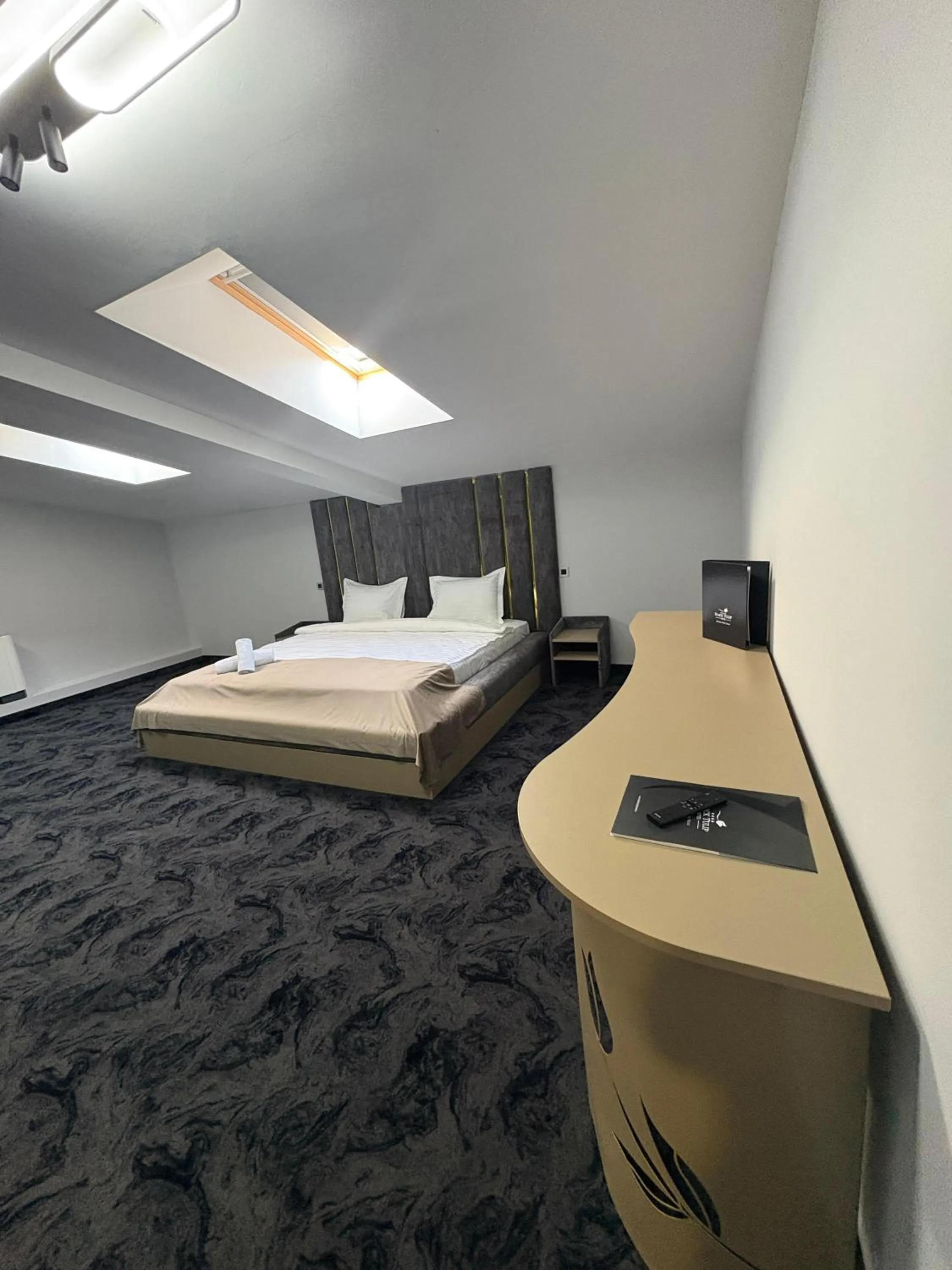 Bed in Black Tulip Hotel