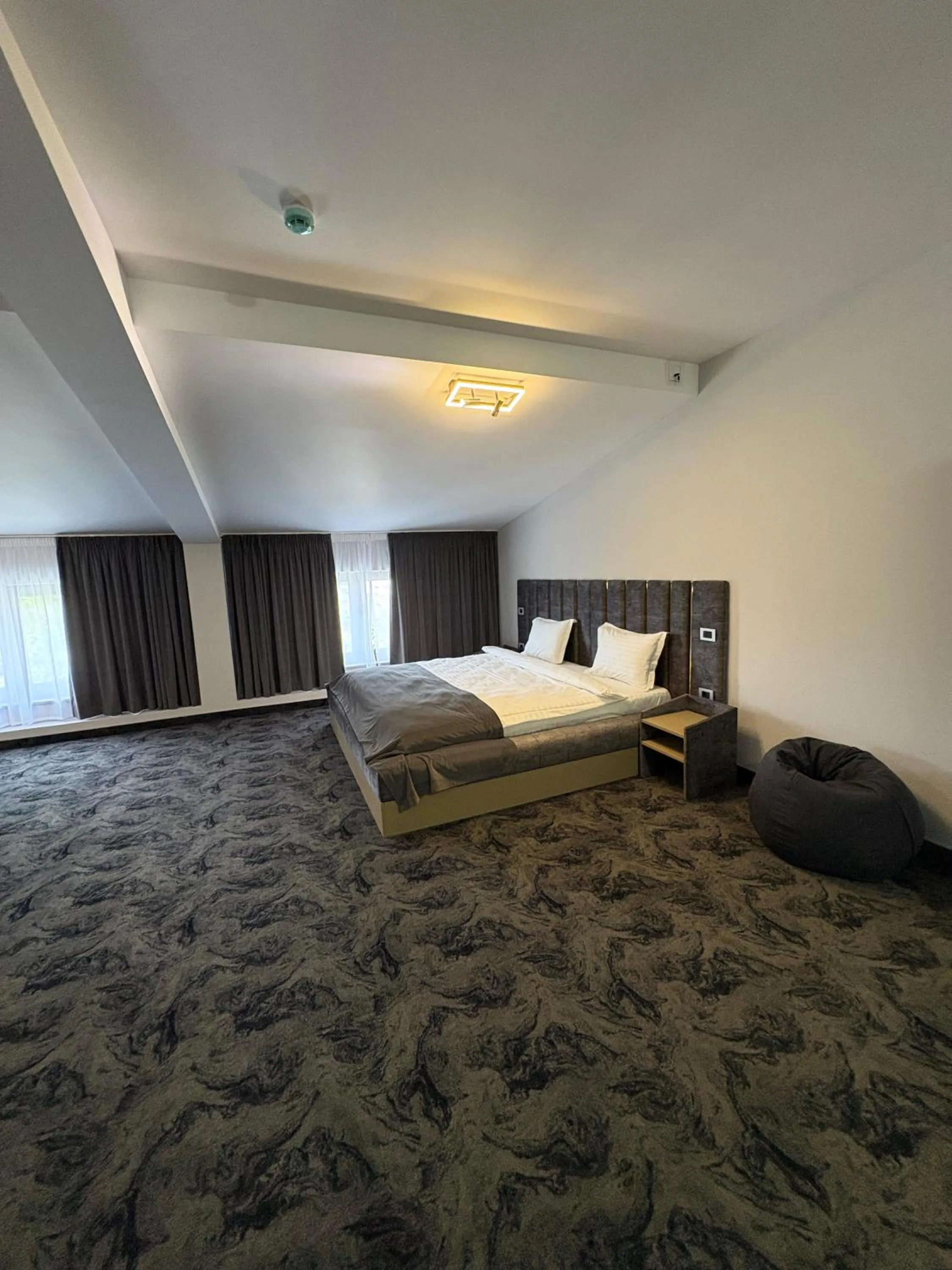 Bed in Black Tulip Hotel