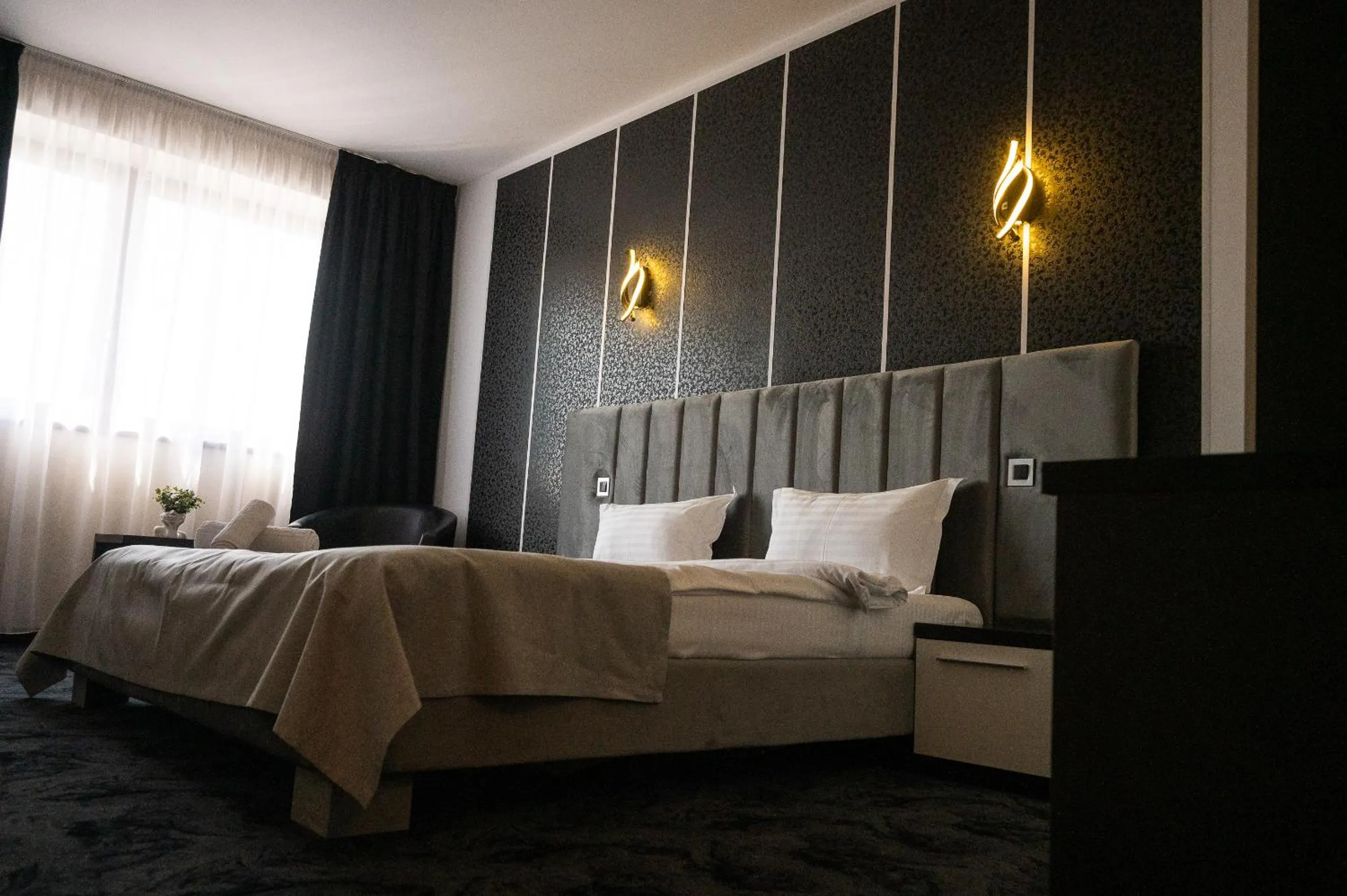 Bed in Black Tulip Hotel