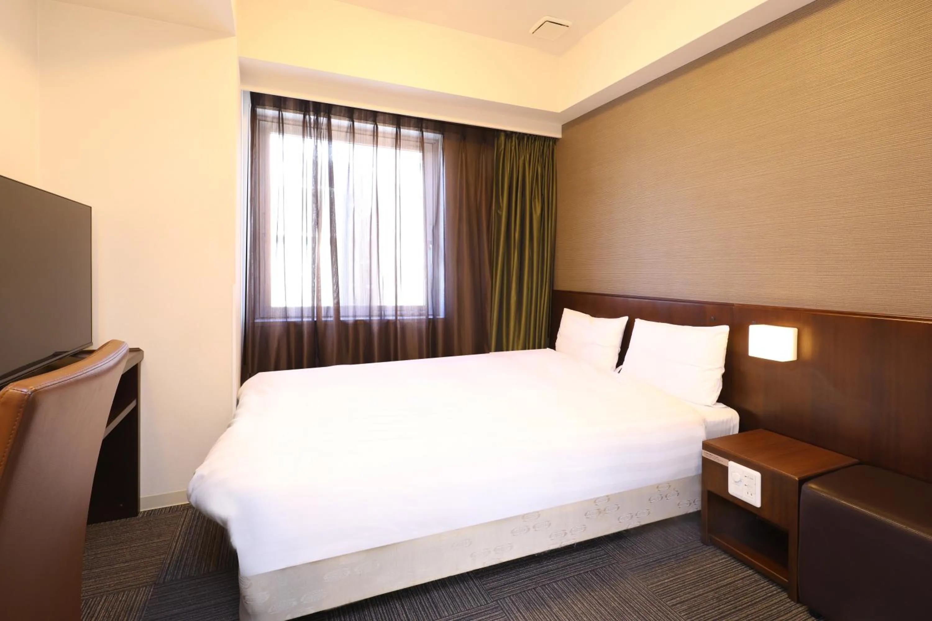 Bed in Dormy Inn Matsumoto