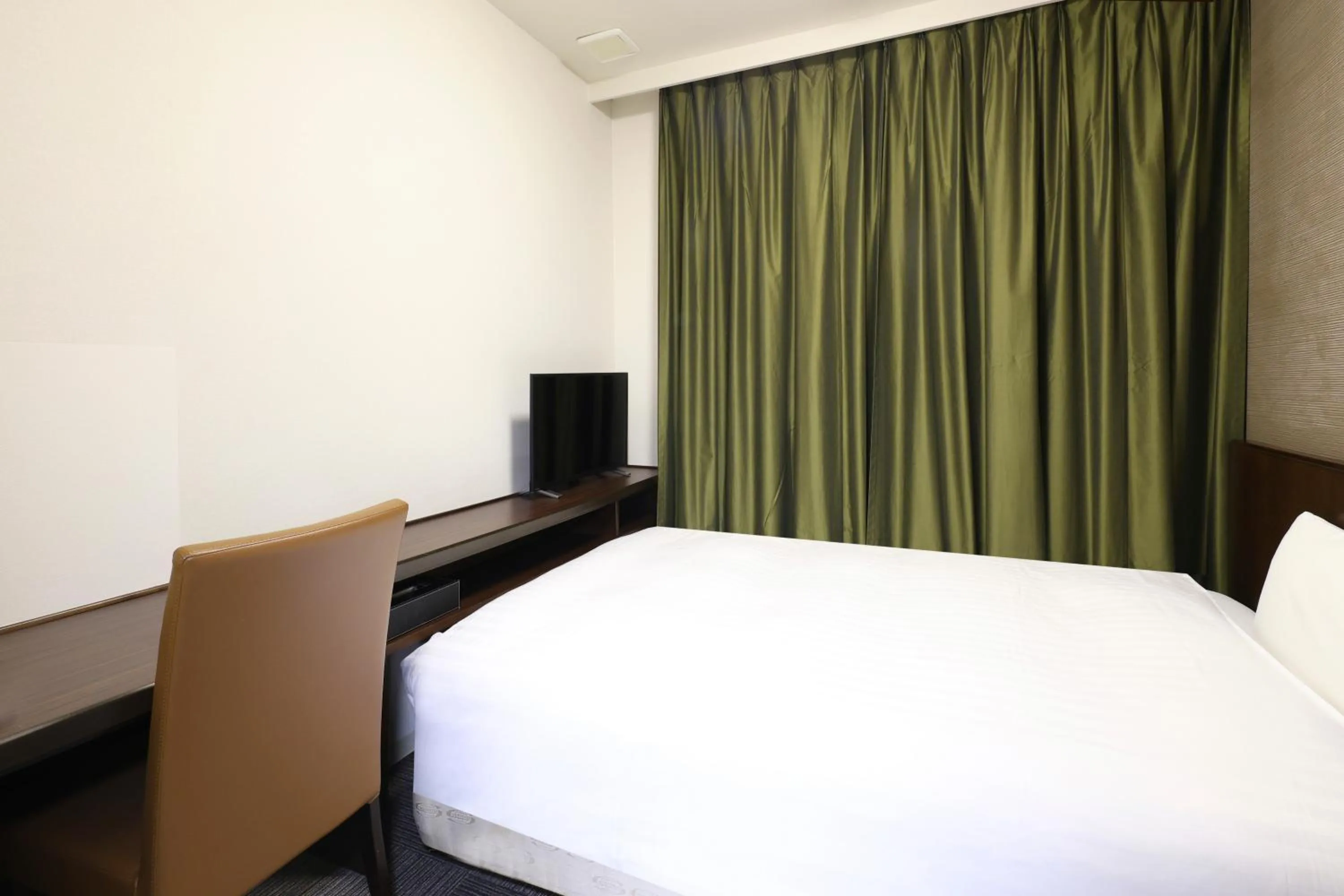 Bed in Dormy Inn Matsumoto