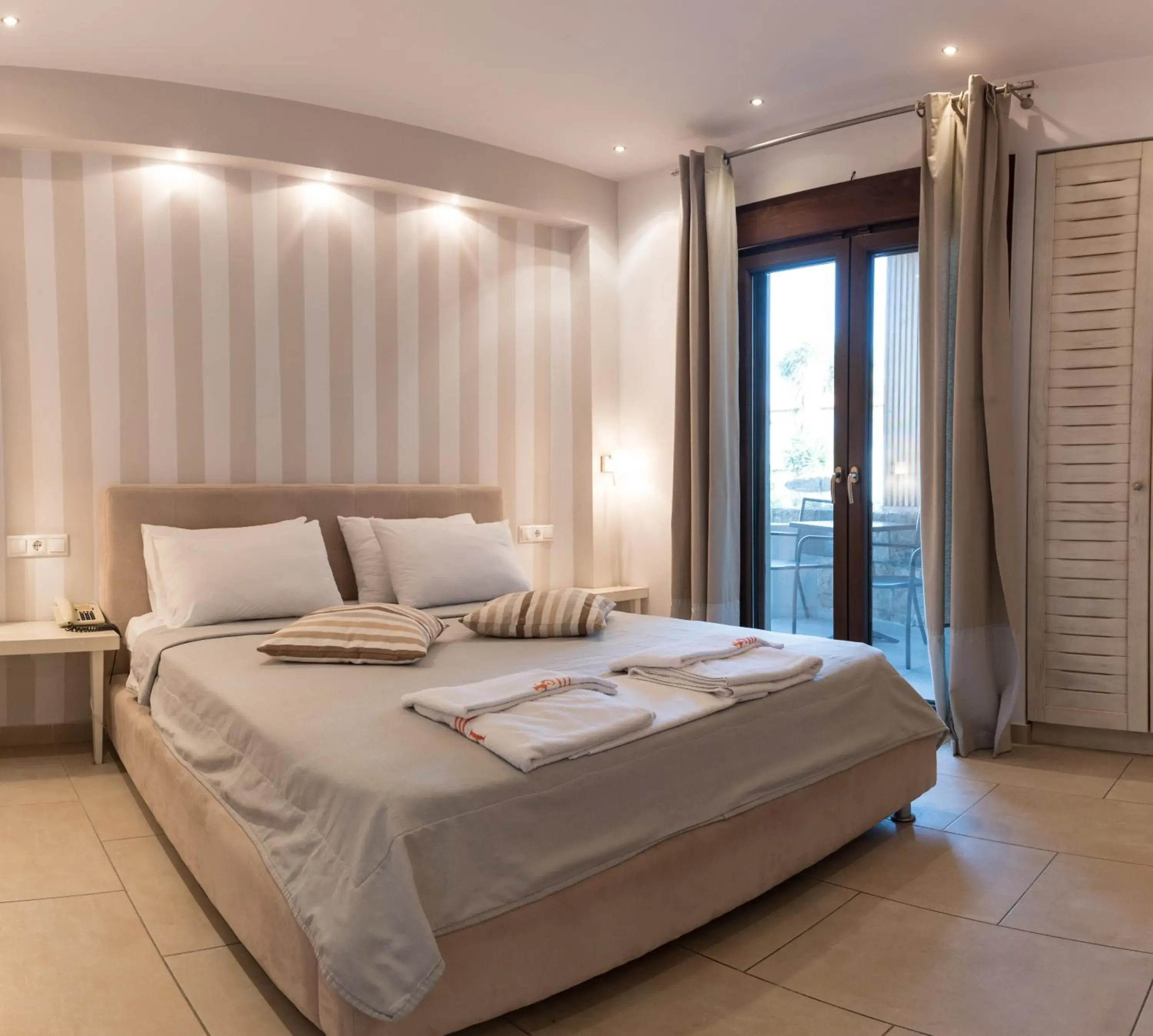 Bed in Stamos Hotel Bed in Stamos Hotel