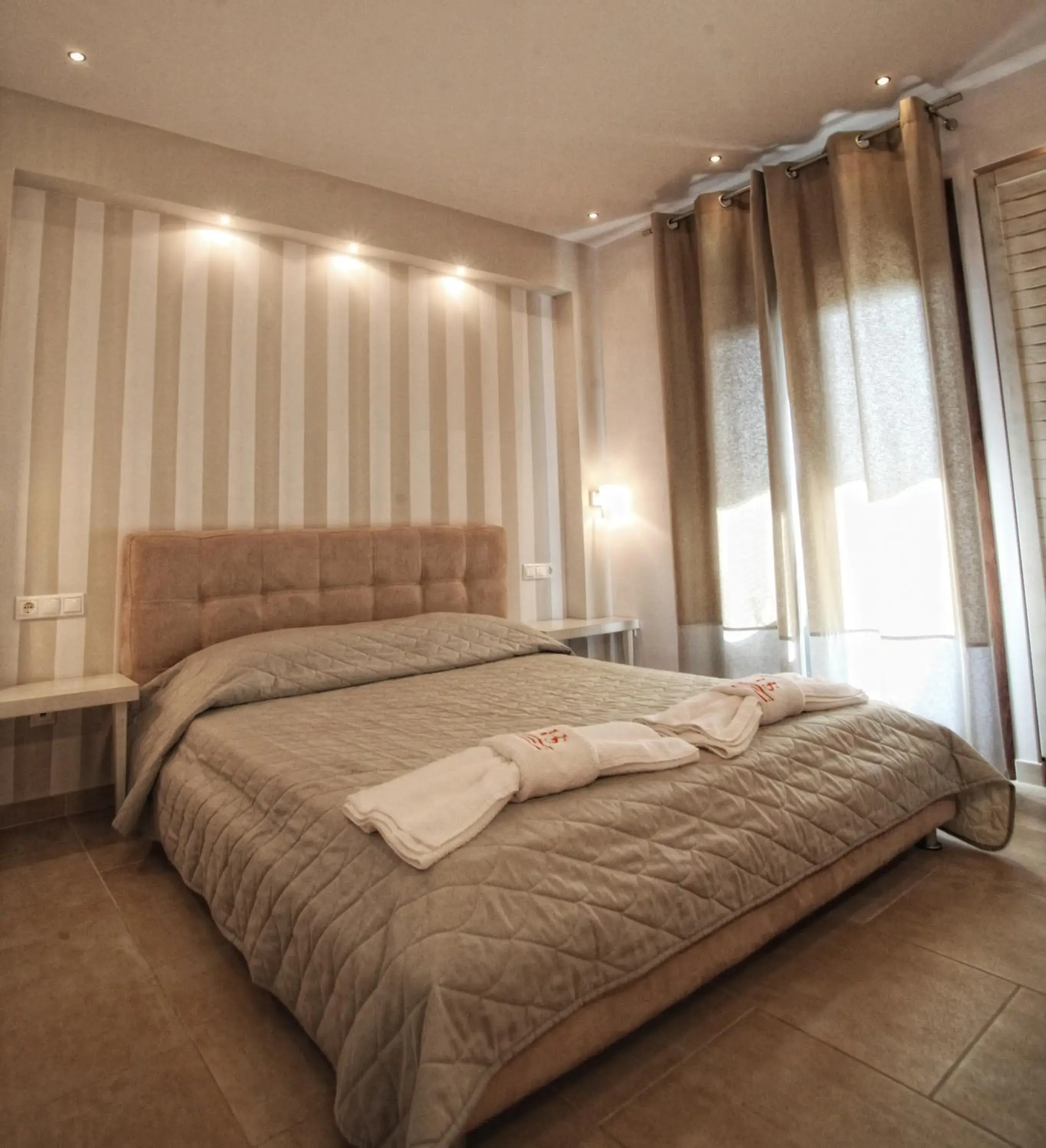 Bed in Stamos Hotel Bed in Stamos Hotel