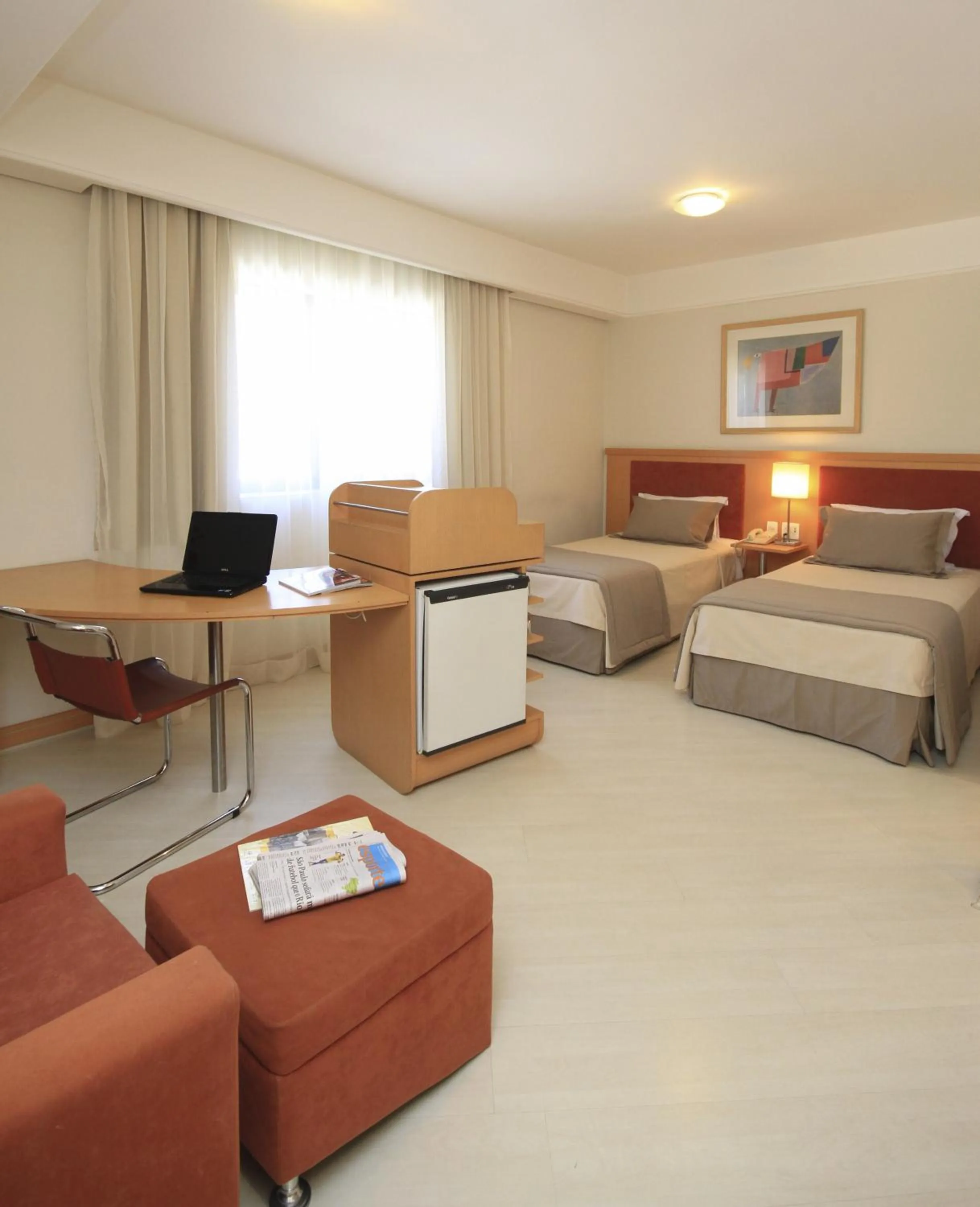 Seating area, Bed in Bienal Suítes