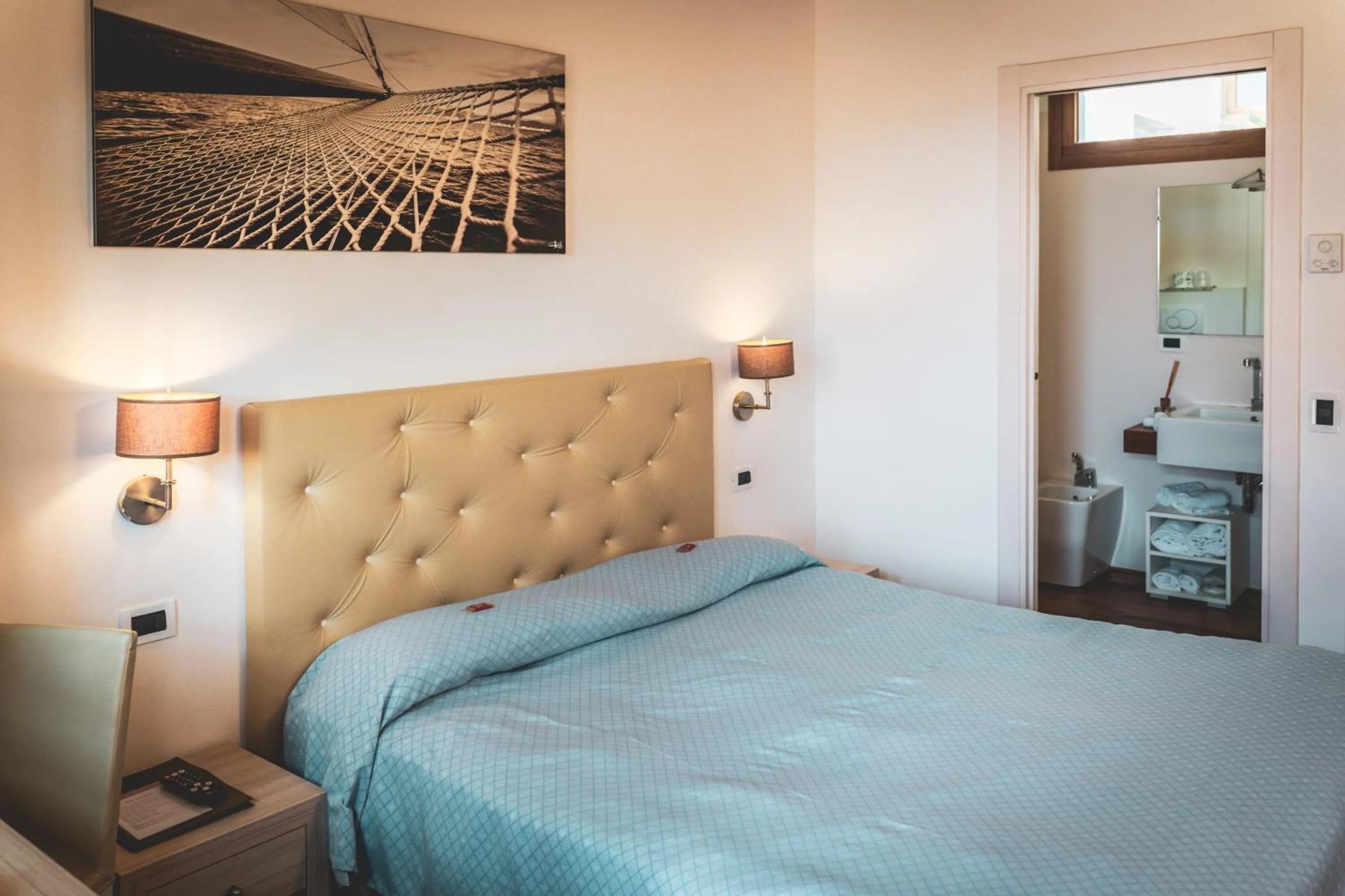 Bed in Tre Merli Beach Hotel