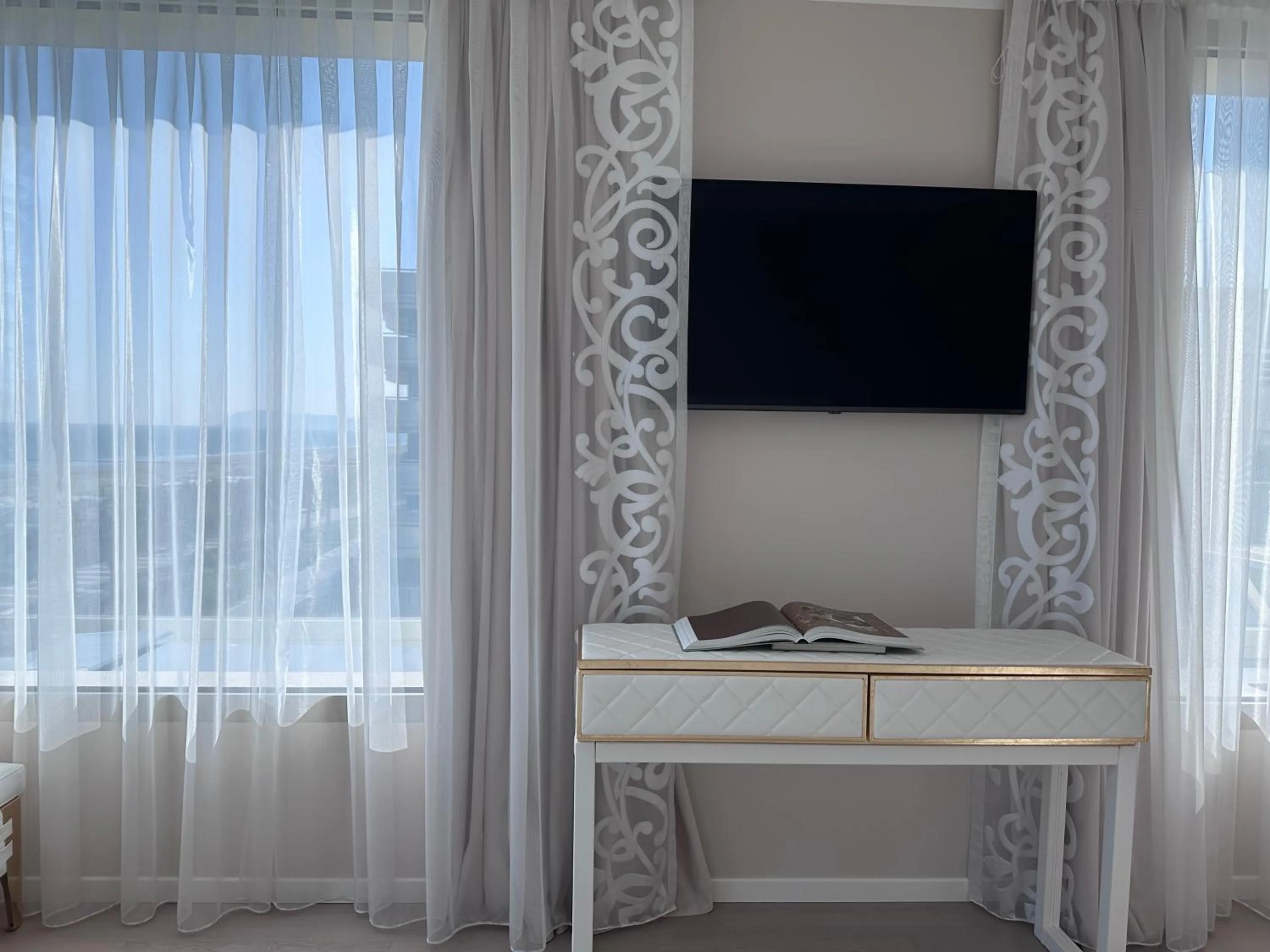 TV and multimedia in The Promenade Luxury Wellness Hotel