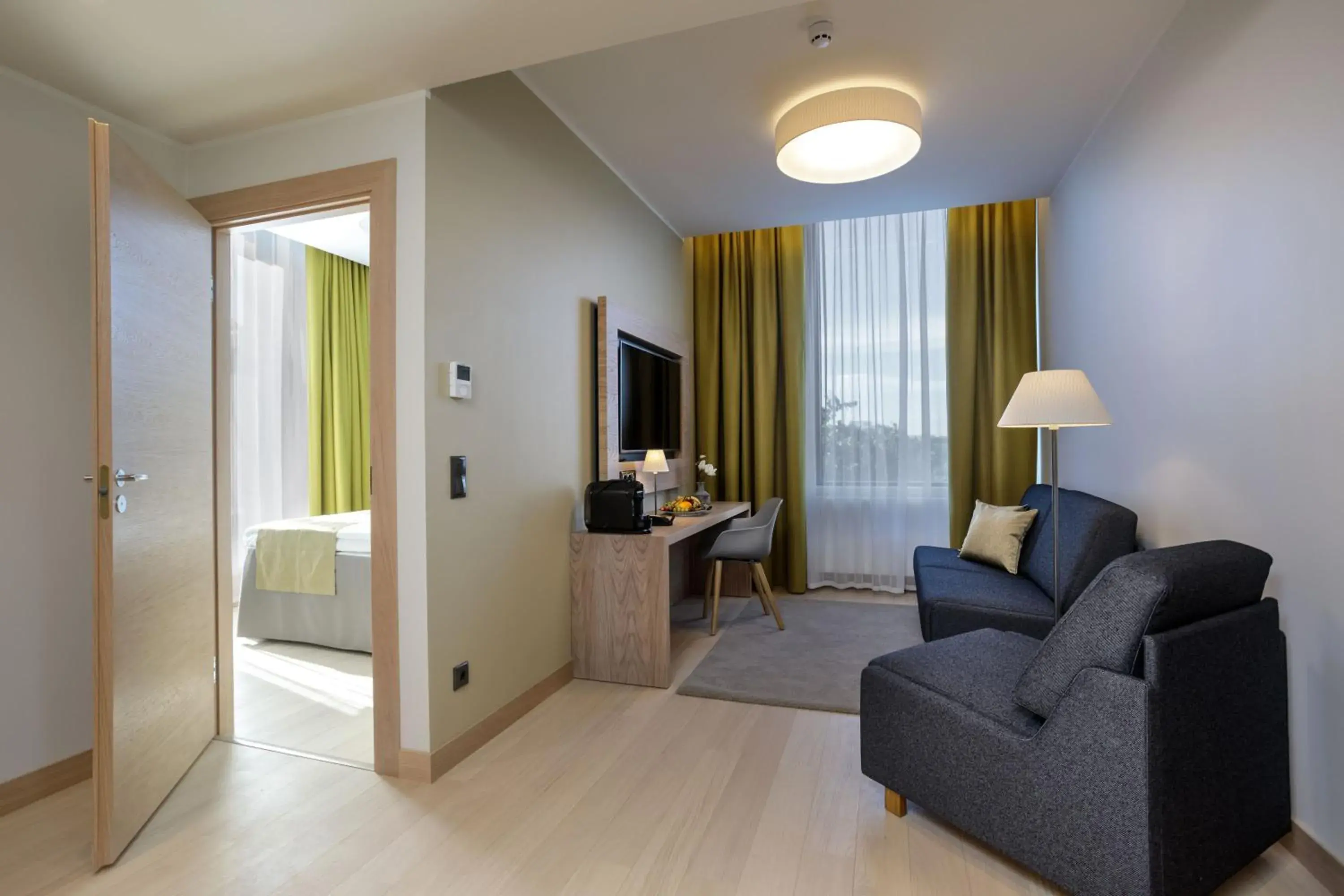 Living room, Bed in Centennial Nexus Hotel Tallinn Living room, Bed in Centennial Nexus Hotel Tallinn