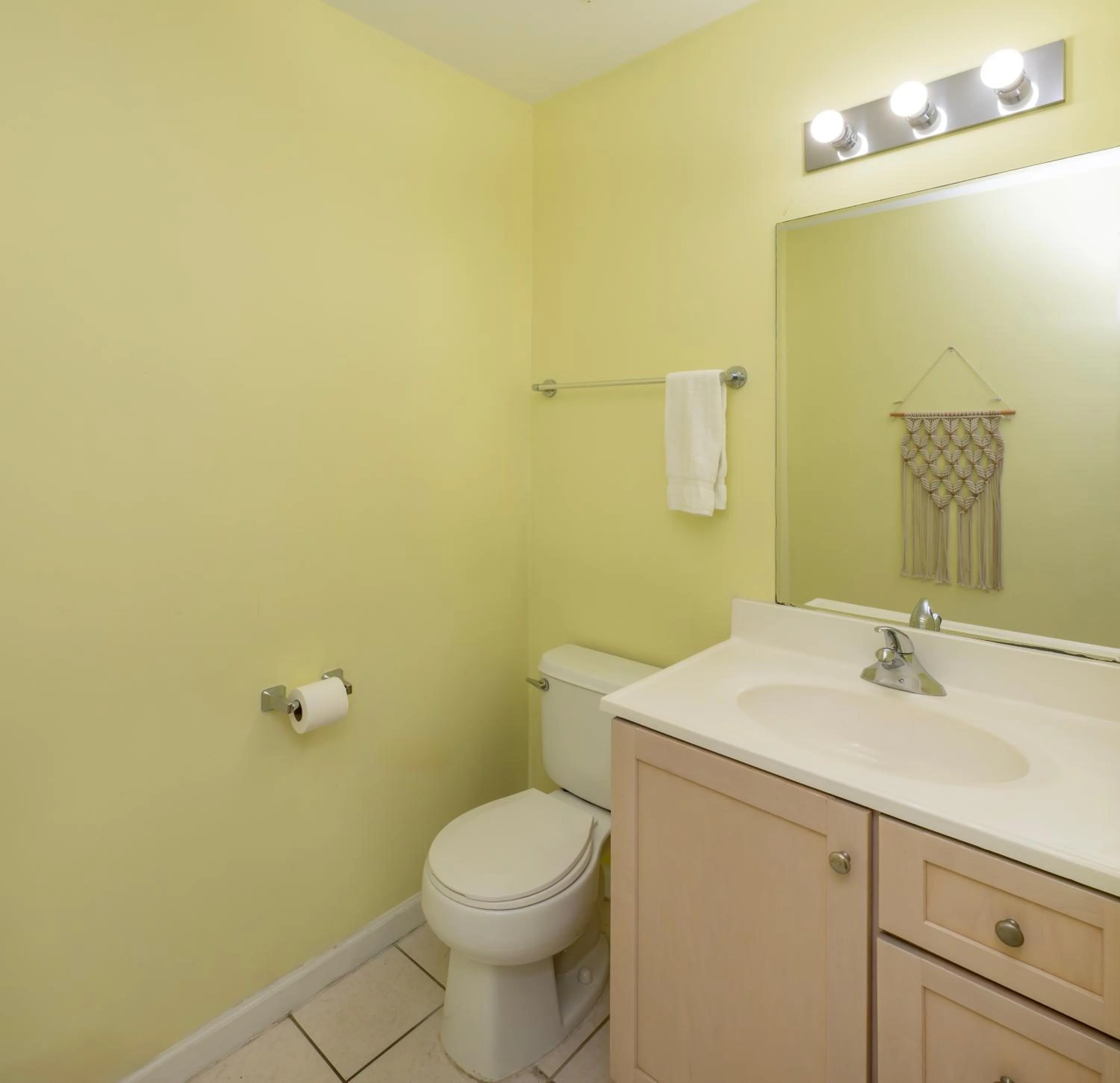 Toilet in Drifting Sands Oceanfront Hotel