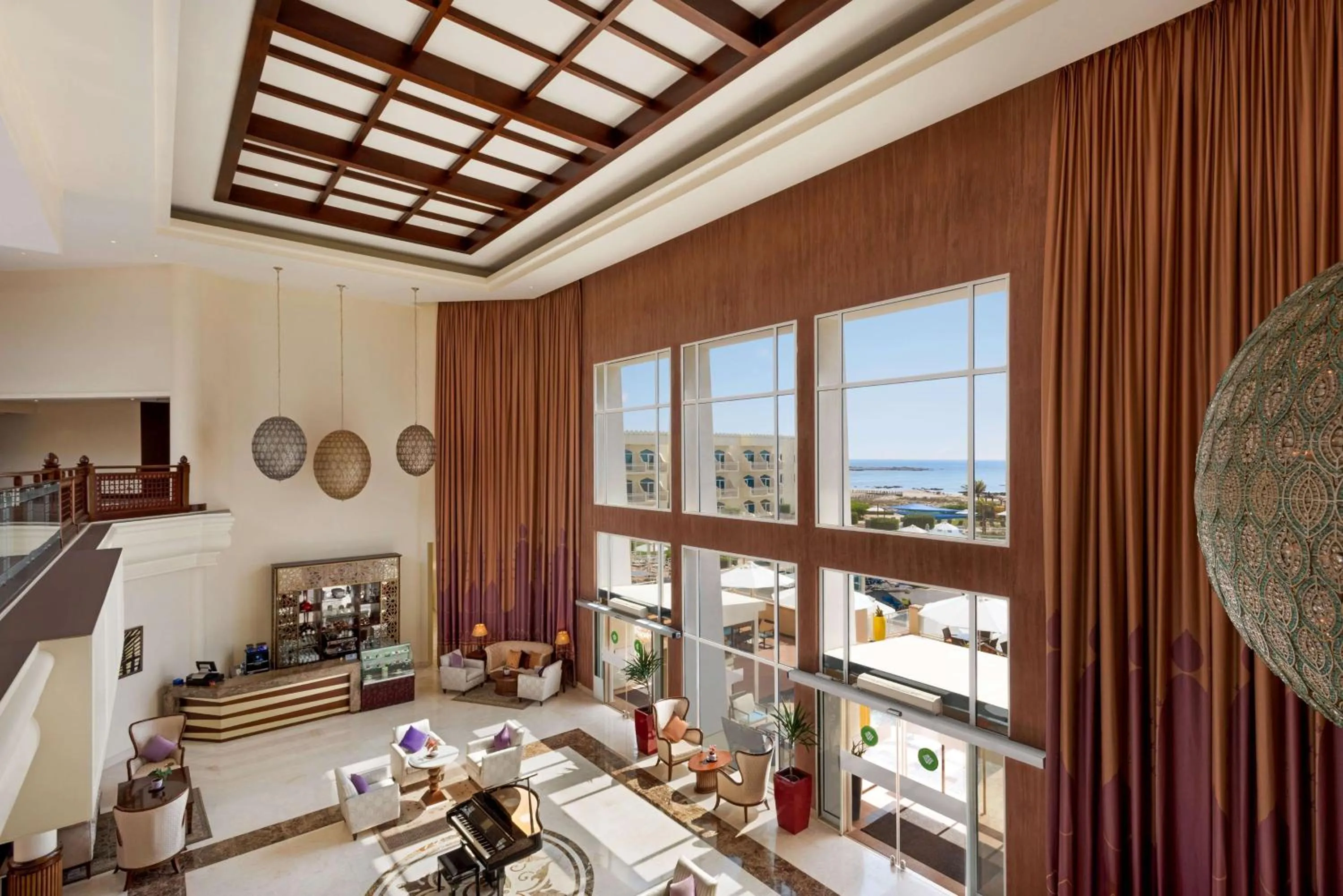 Communal lounge/ TV room in Wyndham Garden Salalah Mirbat