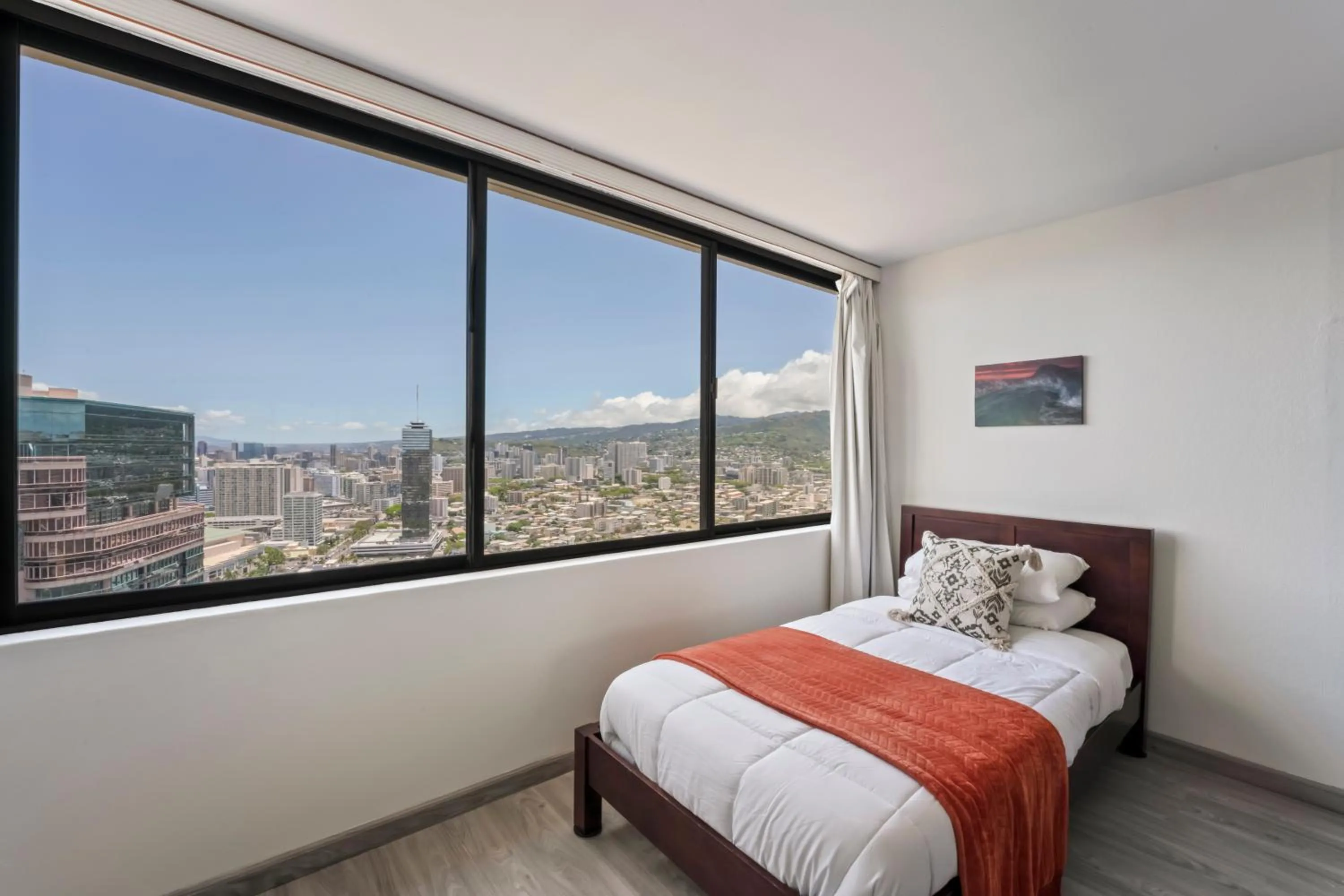 Bed in Hawaiian Monarch Penthouse 104 by Hawaii Ocean Club