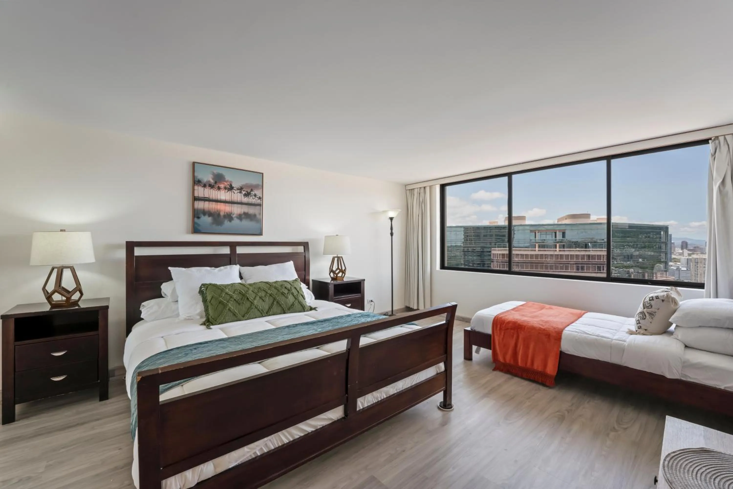 Bed in Hawaiian Monarch Penthouse 104 by Hawaii Ocean Club