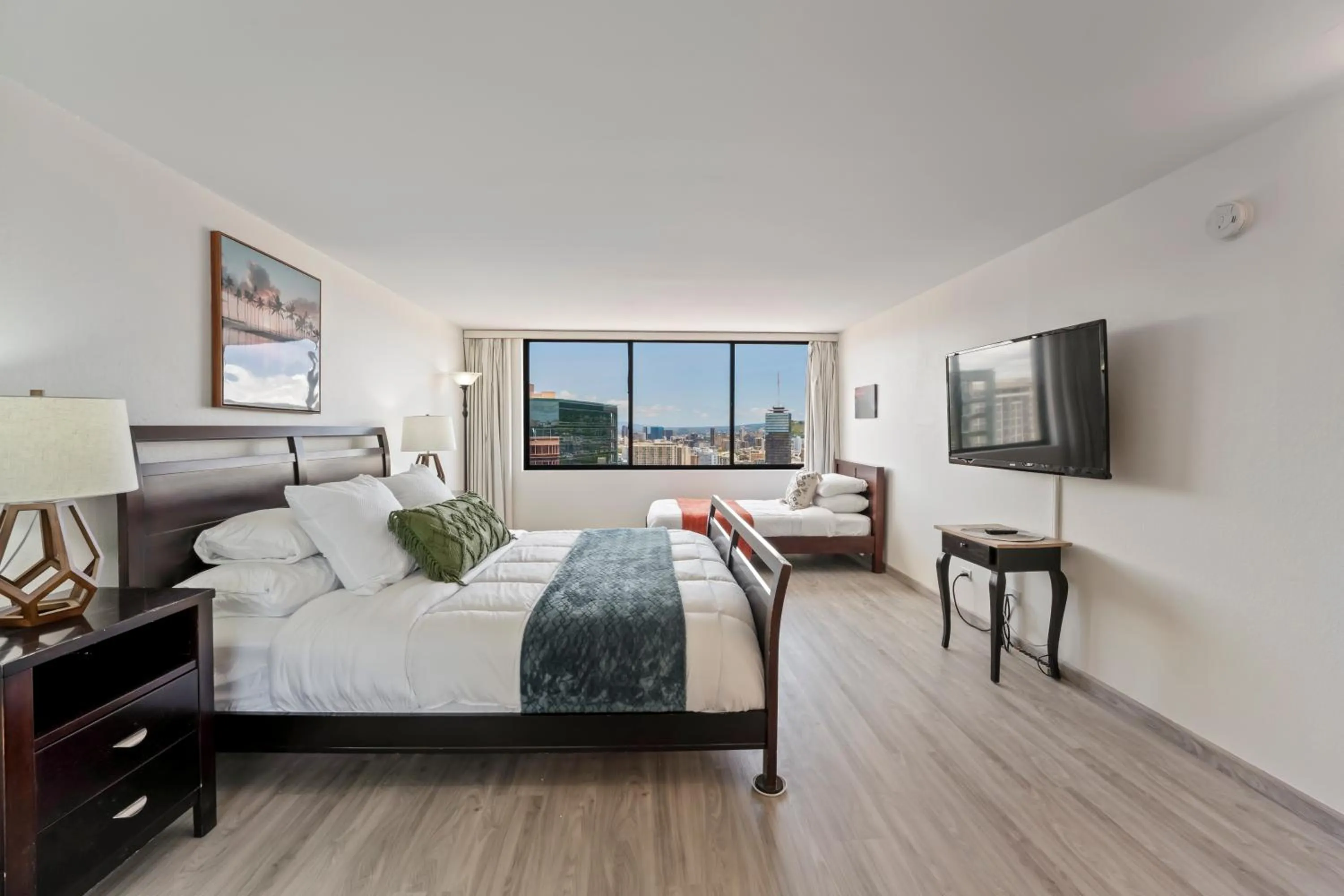 Bed in Hawaiian Monarch Penthouse 104 by Hawaii Ocean Club