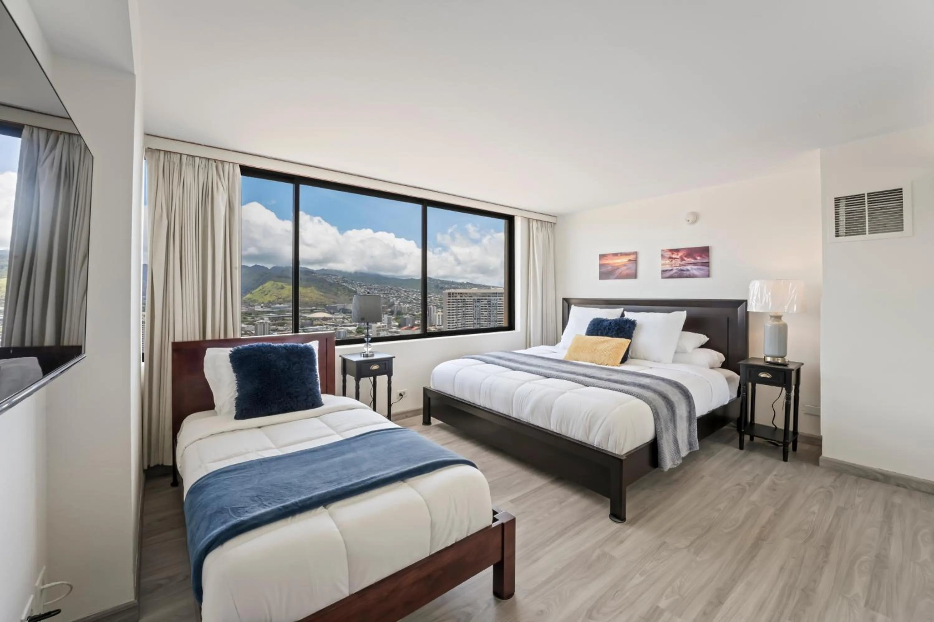 Bed in Hawaiian Monarch Penthouse 104 by Hawaii Ocean Club