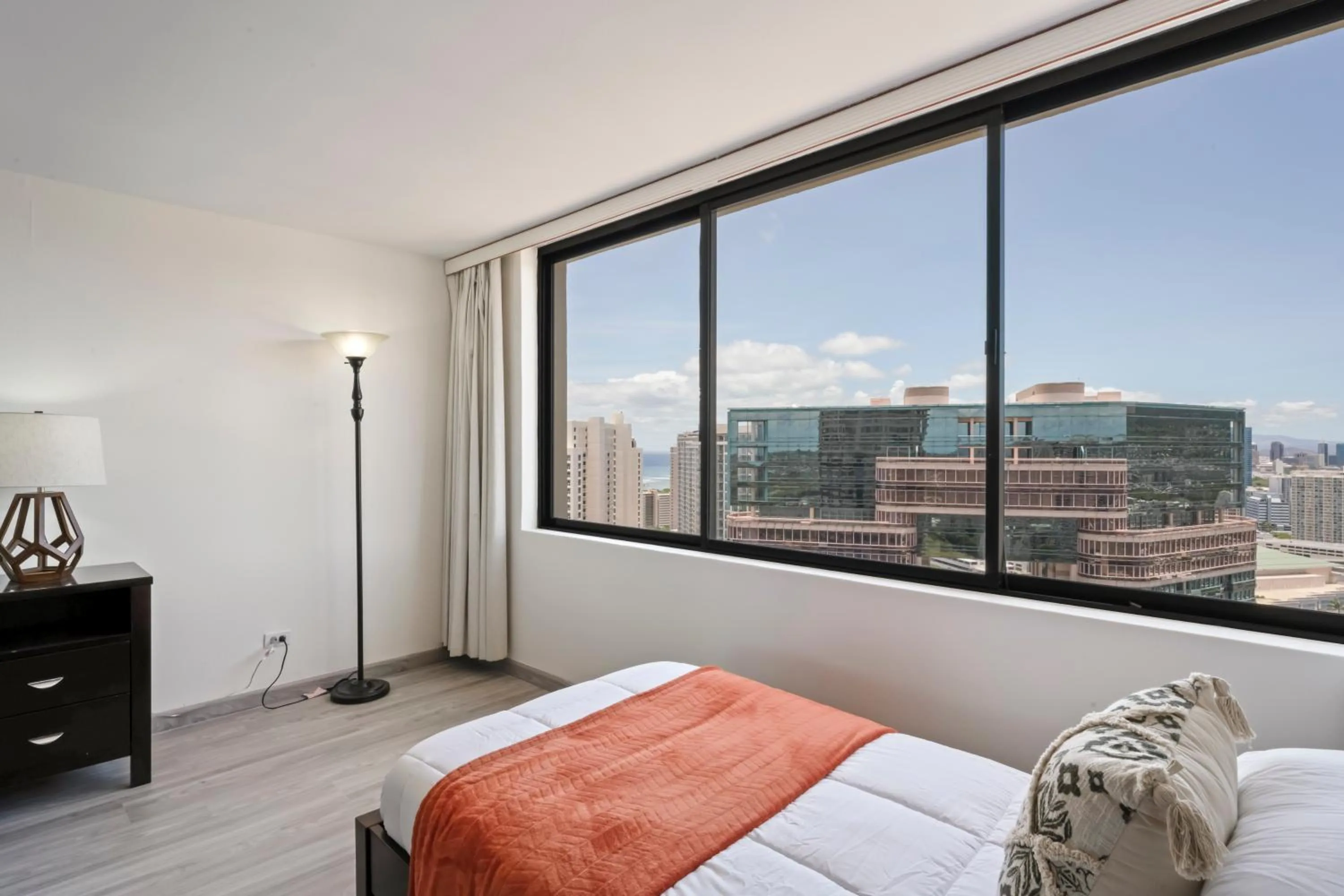 Bed in Hawaiian Monarch Penthouse 104 by Hawaii Ocean Club