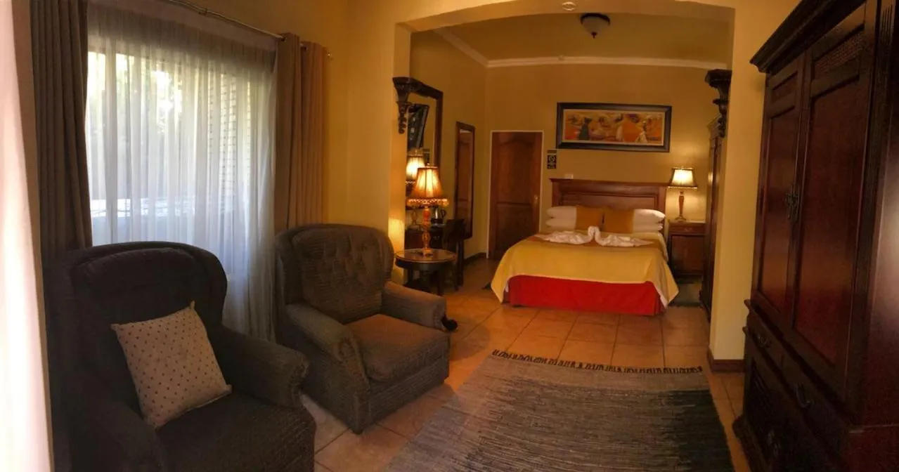 Photo of the whole room in Le Cozmo Guesthouse