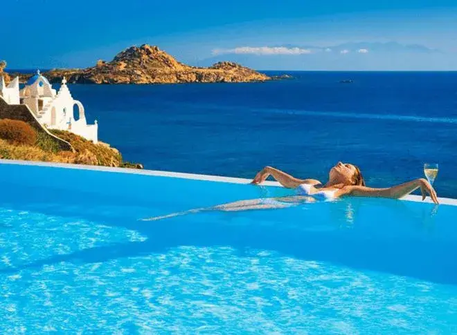 Swimming pool in Petasos Beach Resort & Spa - Small Luxury Hotels of the World Swimming pool in Petasos Beach Resort & Spa - Small Luxury Hotels of the World