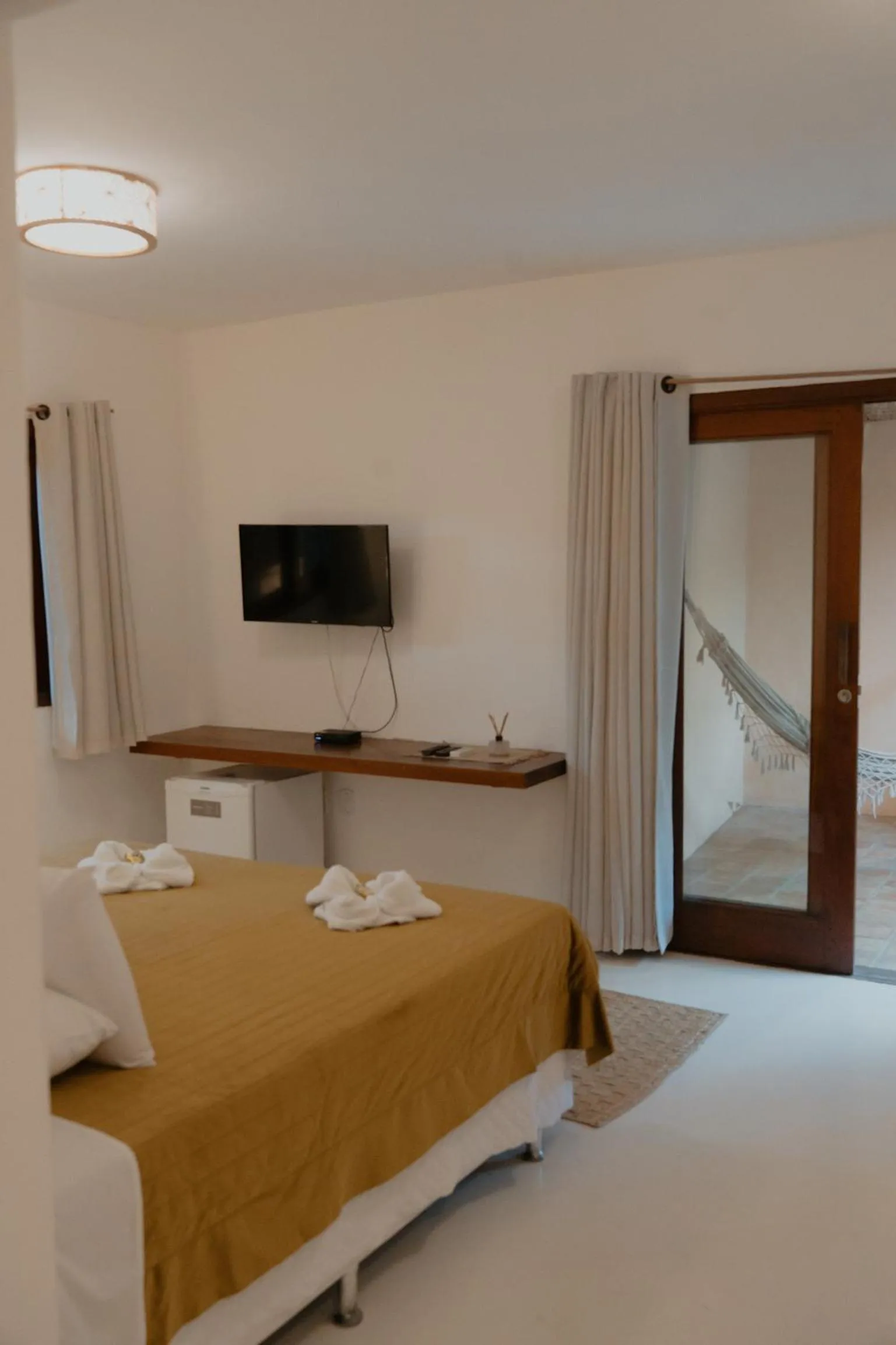 Photo of the whole room, Bed in Pousada Erva Doce