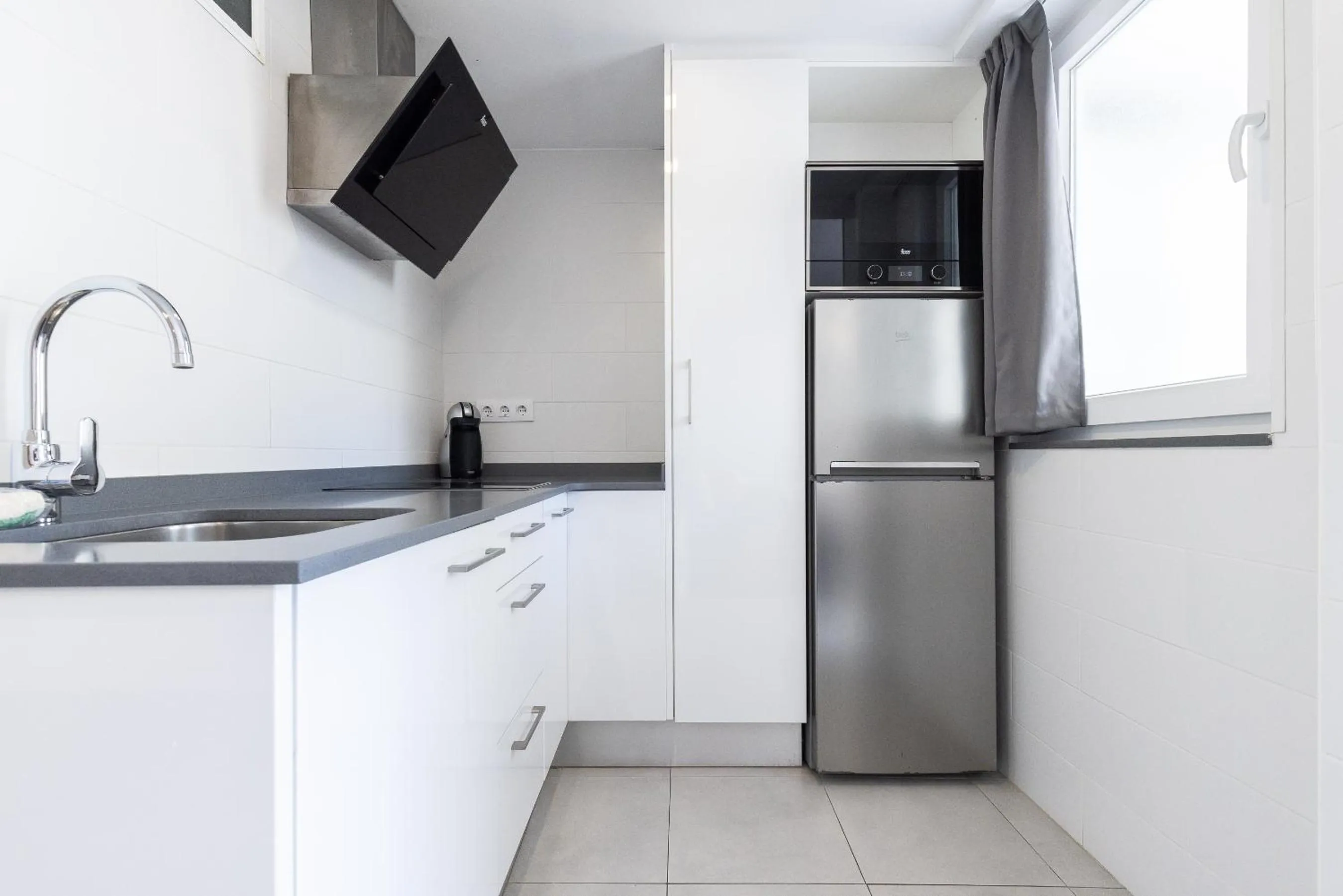 Kitchen or kitchenette in Rentalmar Aries Plus