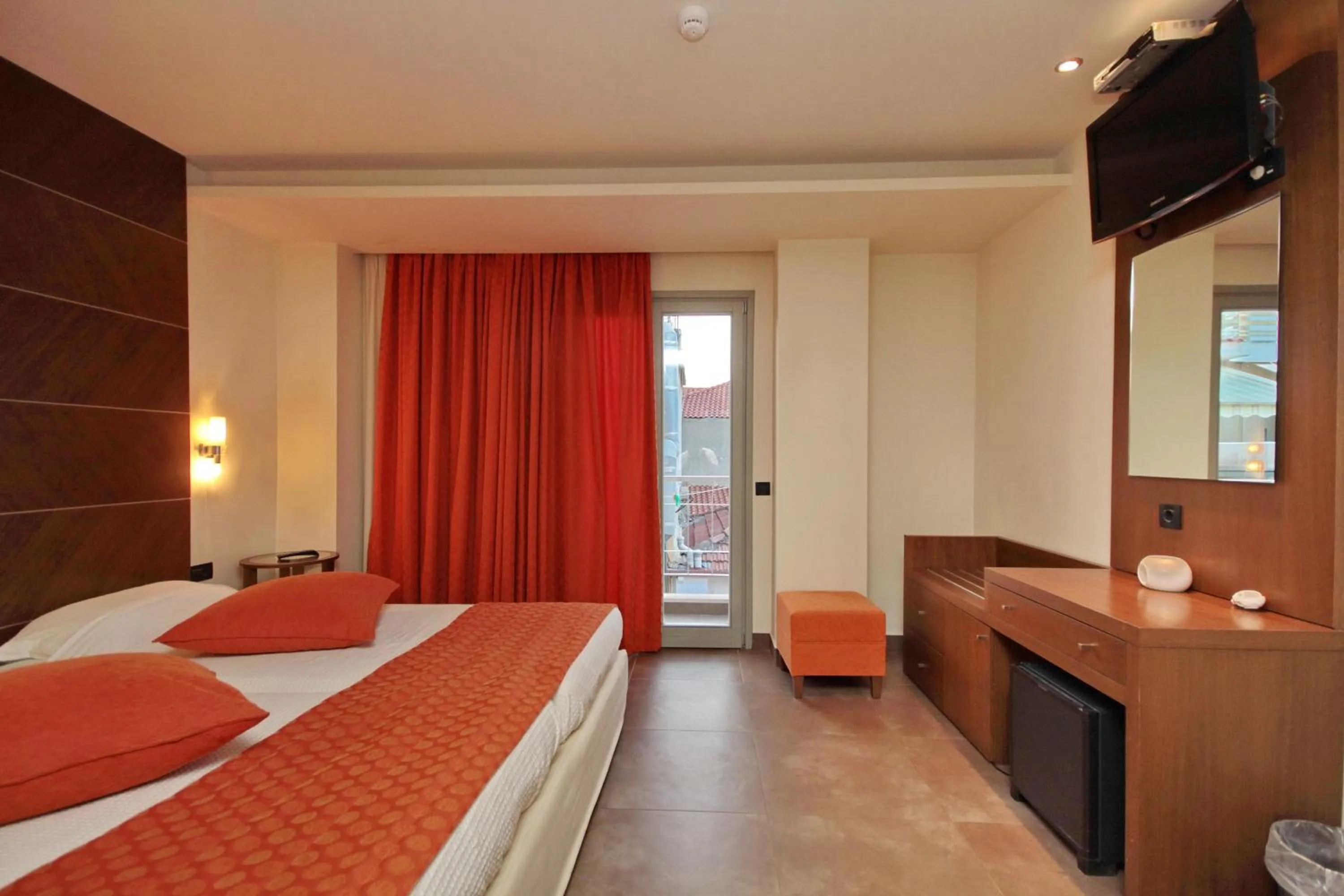 Bed in Astros Beach Boutique Hotel